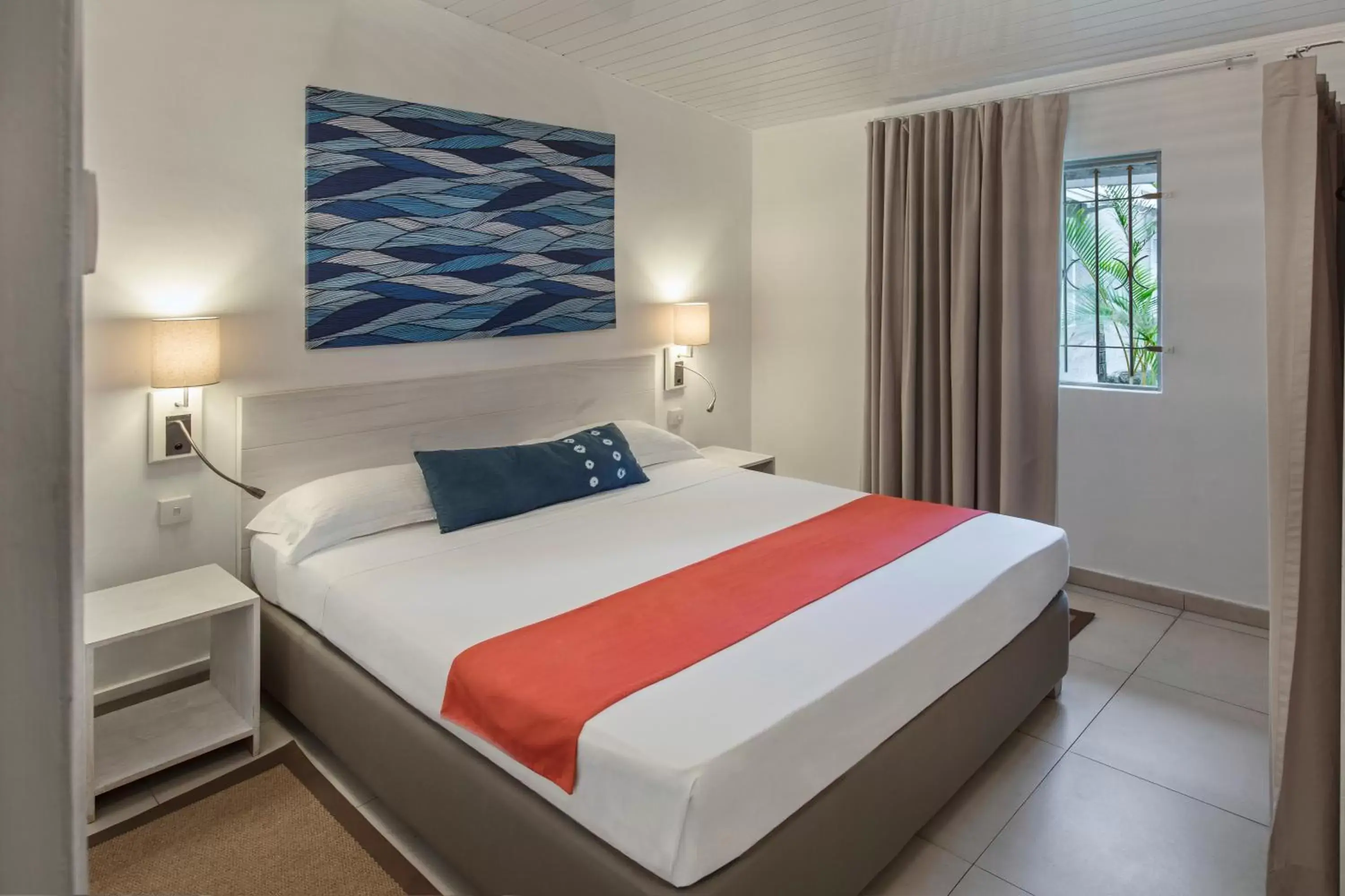Bed in Astroea Beach Hotel
