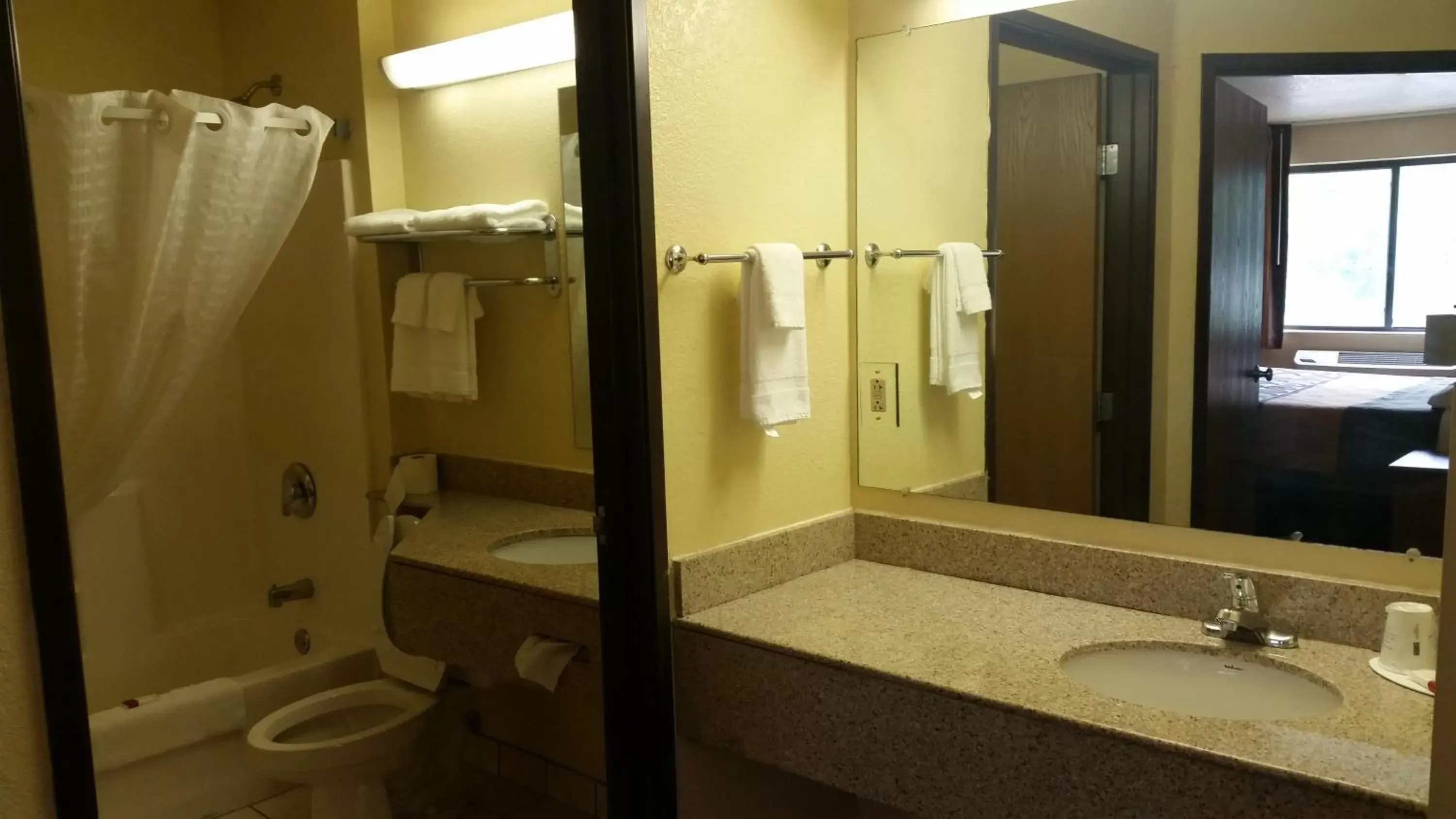 Photo of the whole room, Bathroom in Super 8 by Wyndham Wheeling St Clairsville OH Area