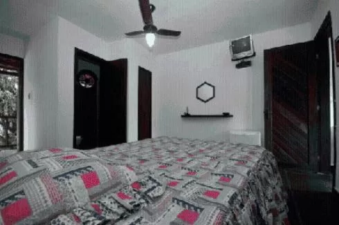 Bed in Pousada A Marca do Faraó