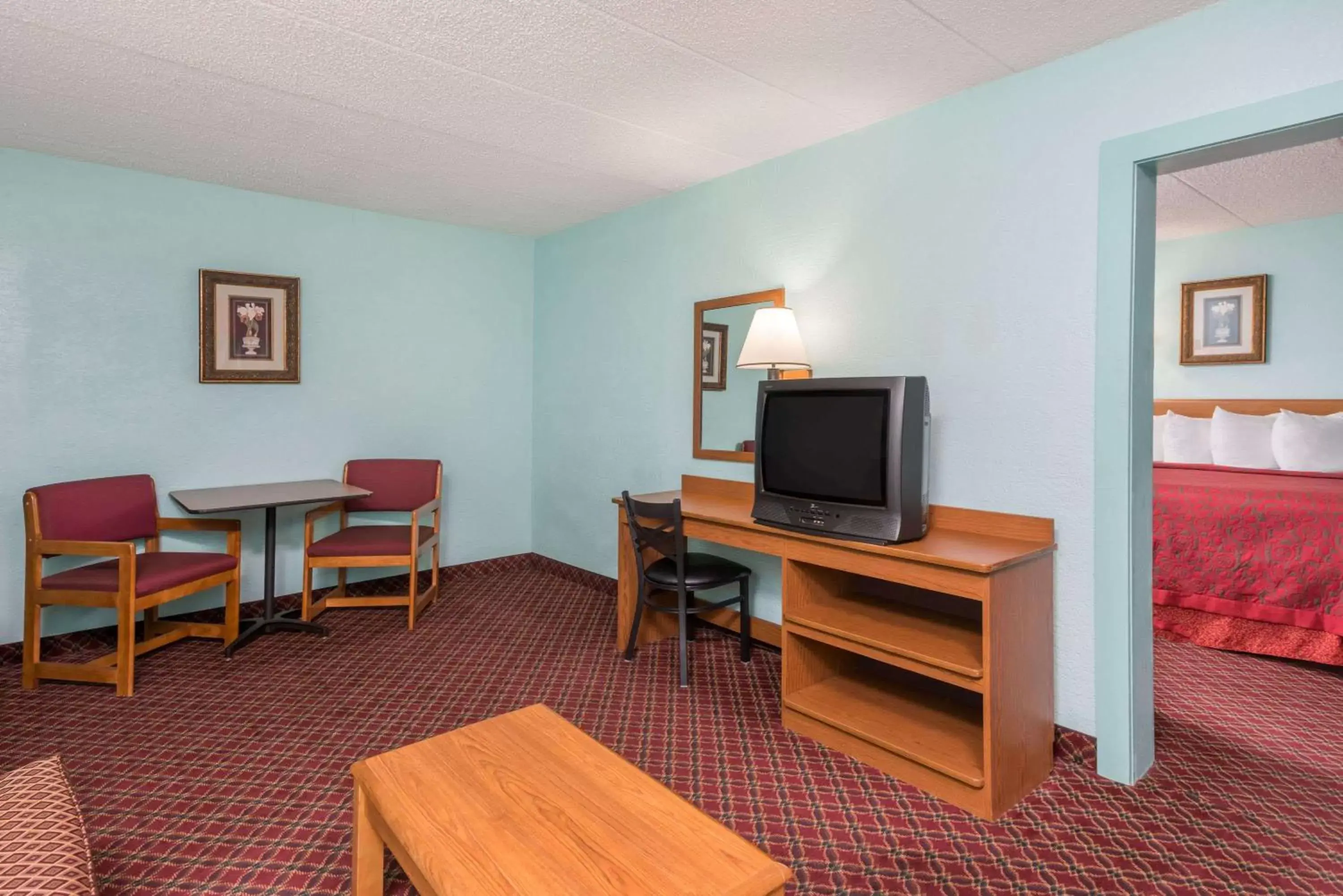Photo of the whole room, TV/Entertainment Center in Days Inn & Suites by Wyndham Springfield on I-44
