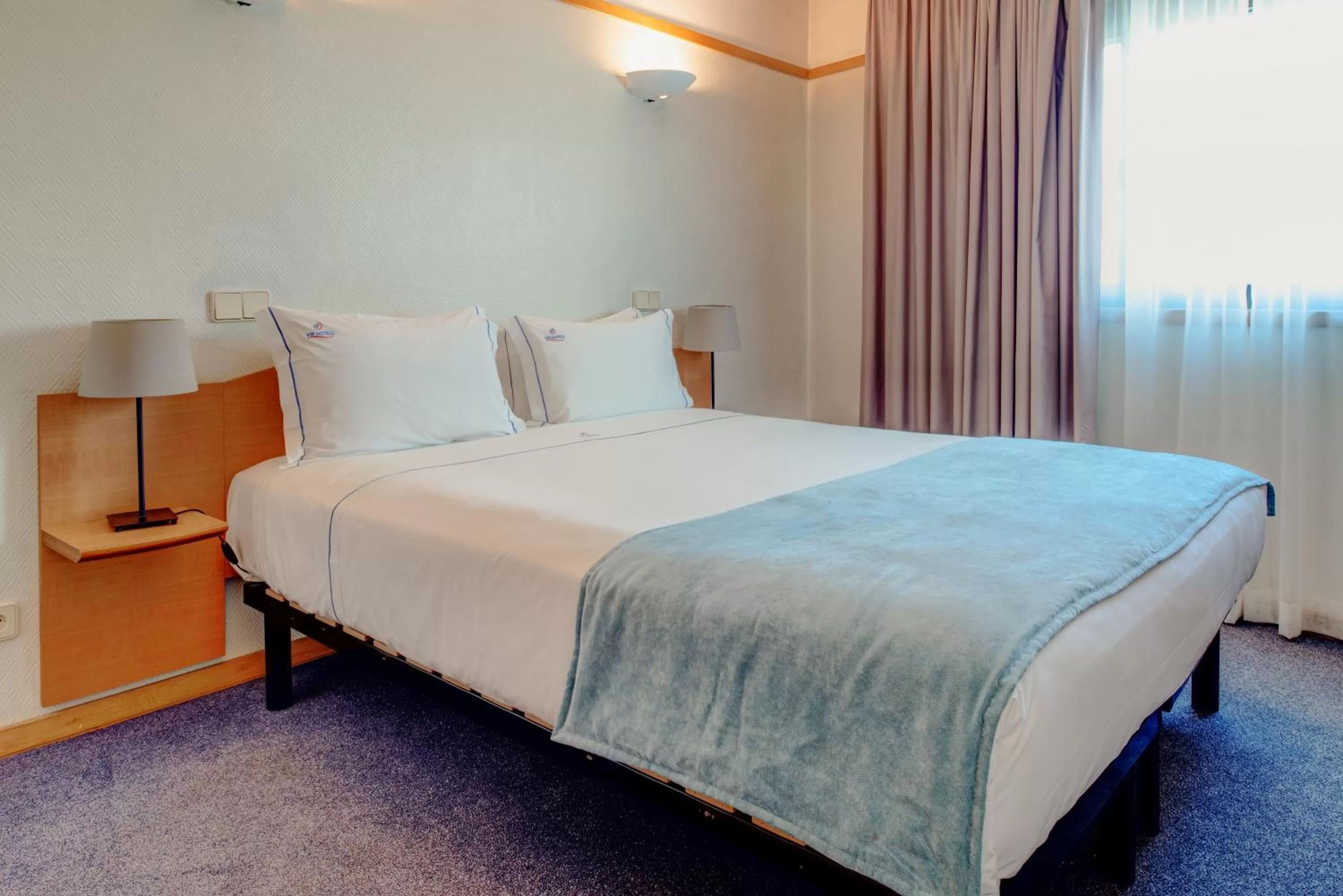 Bed in VIP Executive Eden Aparthotel