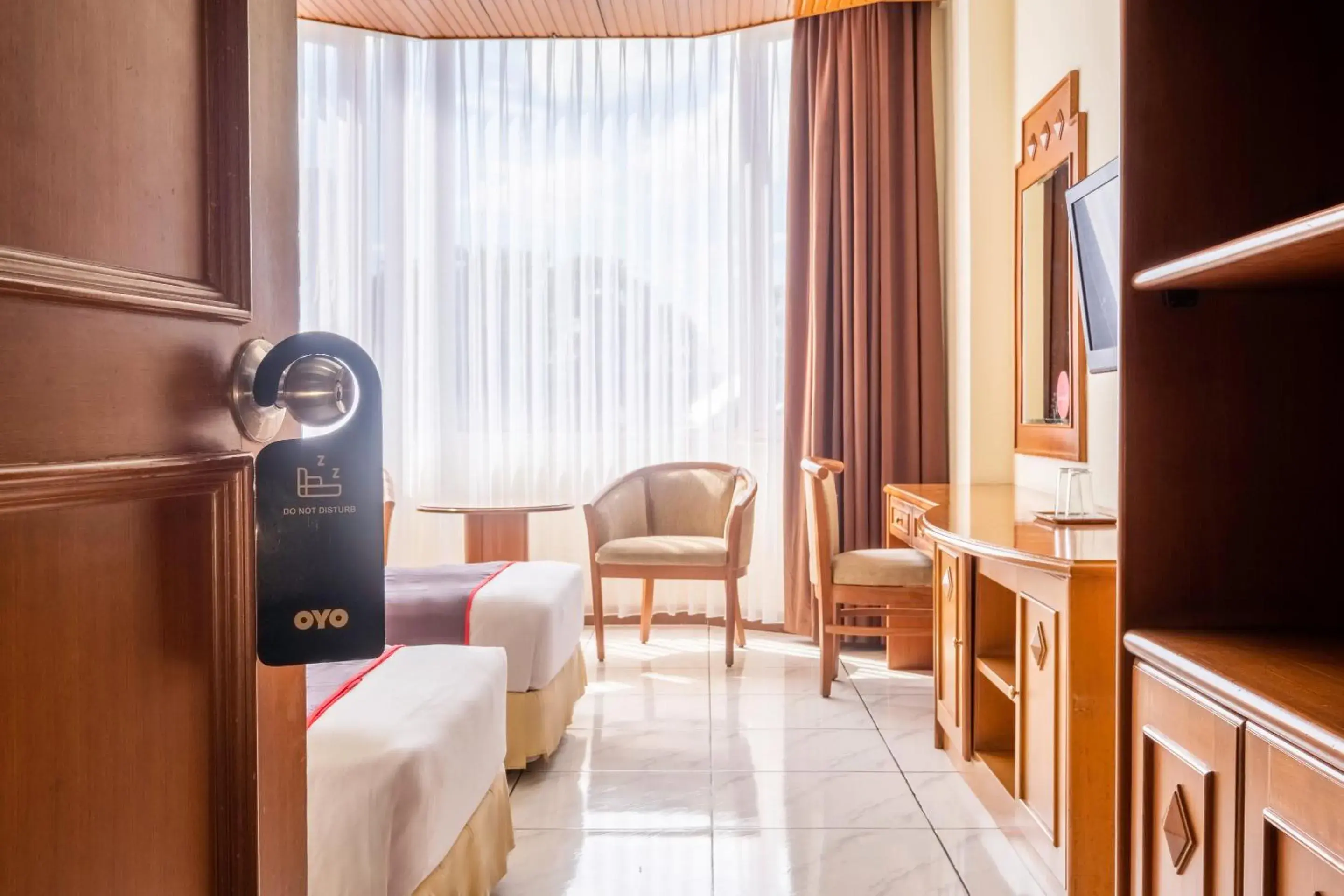 Bedroom, Seating Area in SUPER OYO Collection O 25 Hotel Baltika