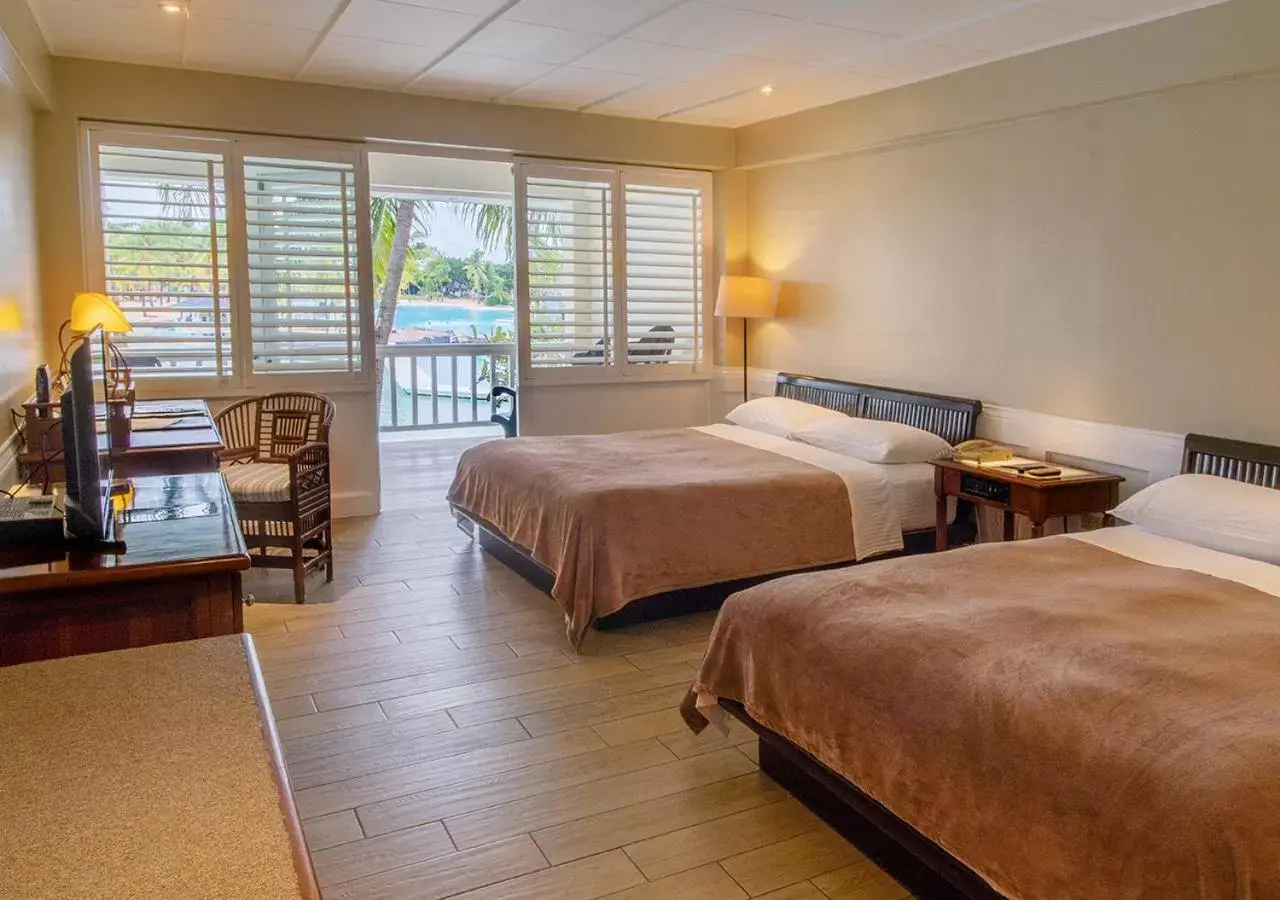 Bed in Plantation Bay Resort and Spa