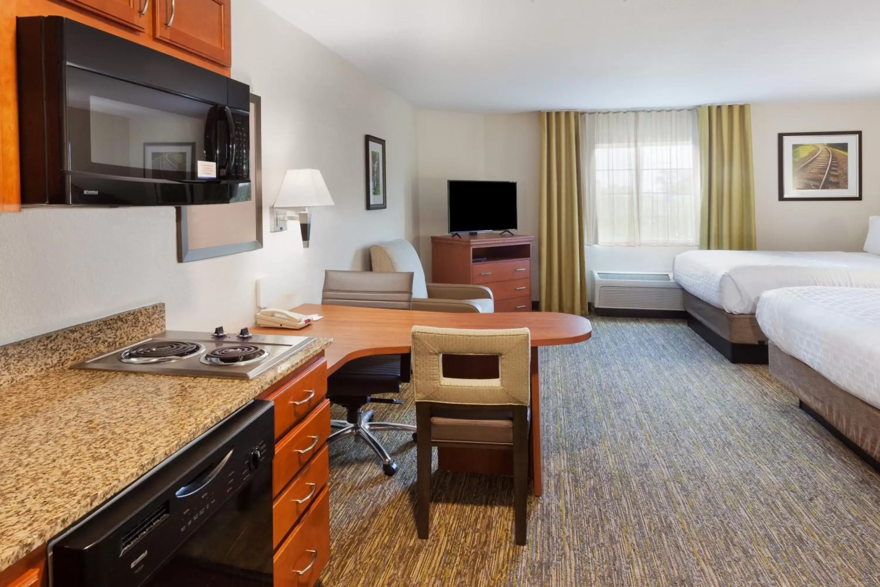 Photo of the whole room, Seating Area in Candlewood Suites Eastchase Park, an IHG Hotel