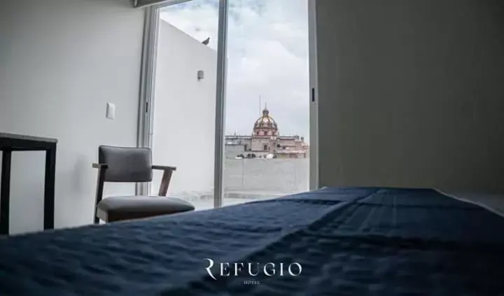 Bed in Hotel Refugio