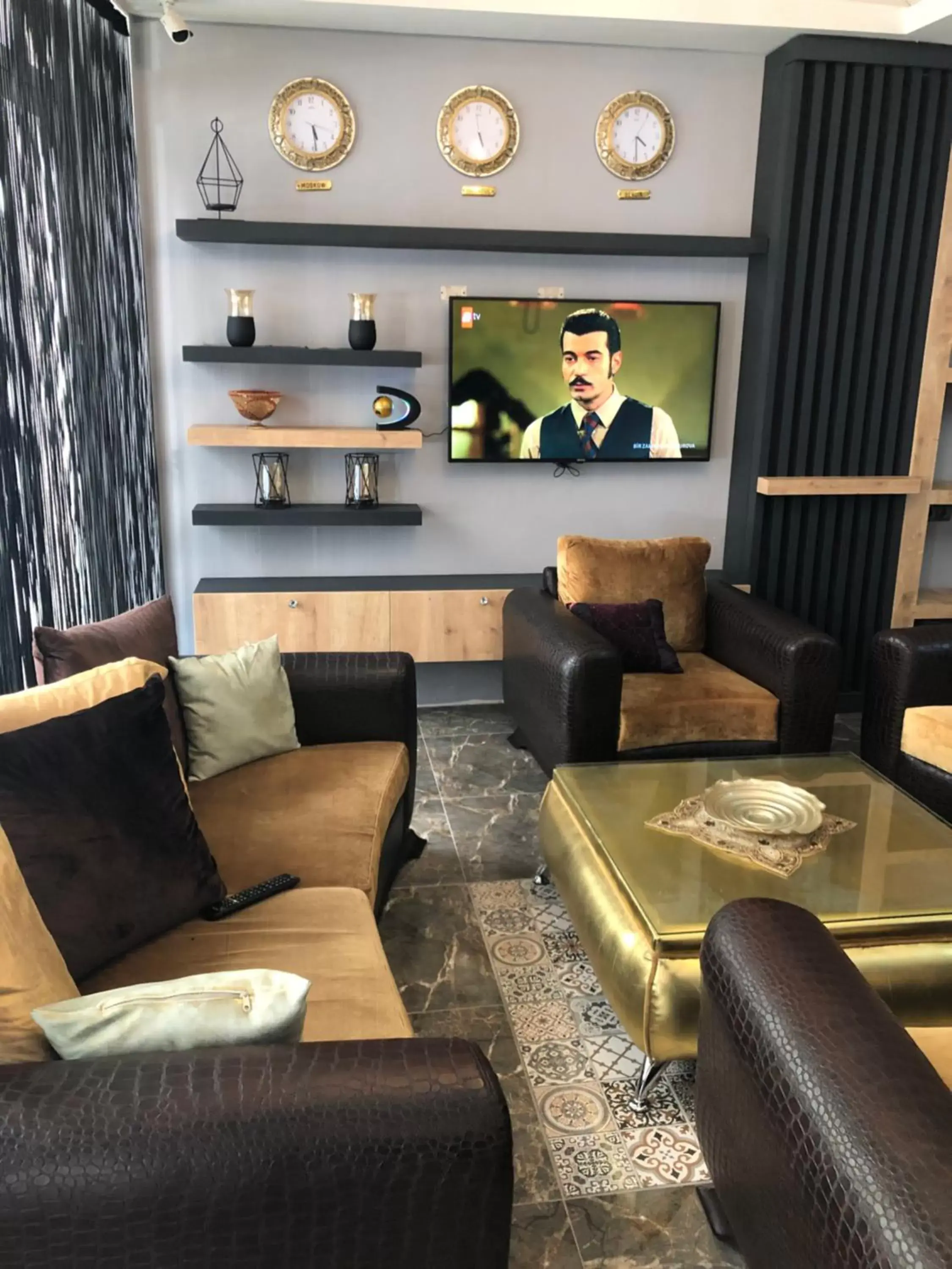 Communal lounge/ TV room, Seating Area in Orange Airport Hotel