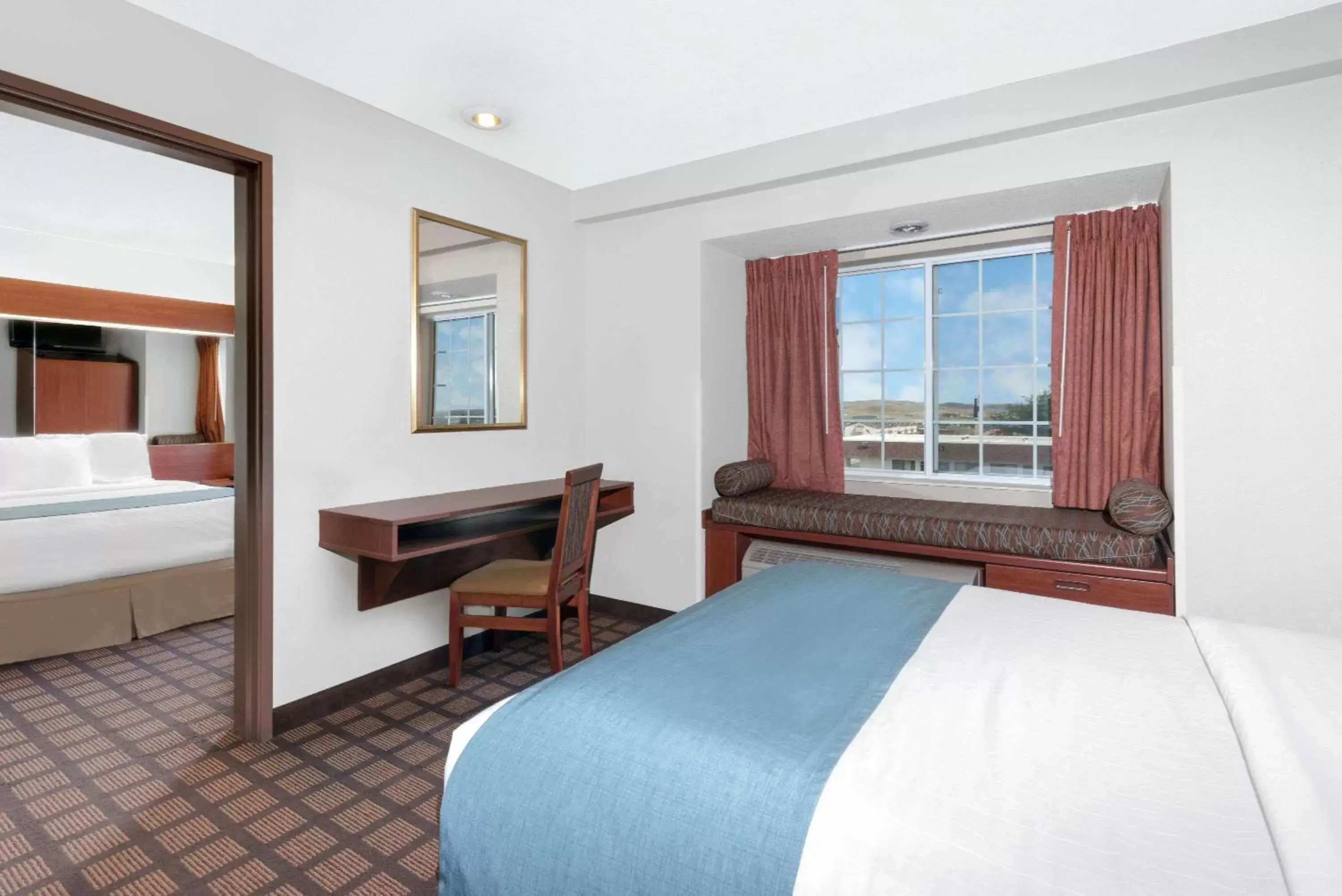 Photo of the whole room, Bed in Microtel Inn & Suites by Wyndham Rapid City