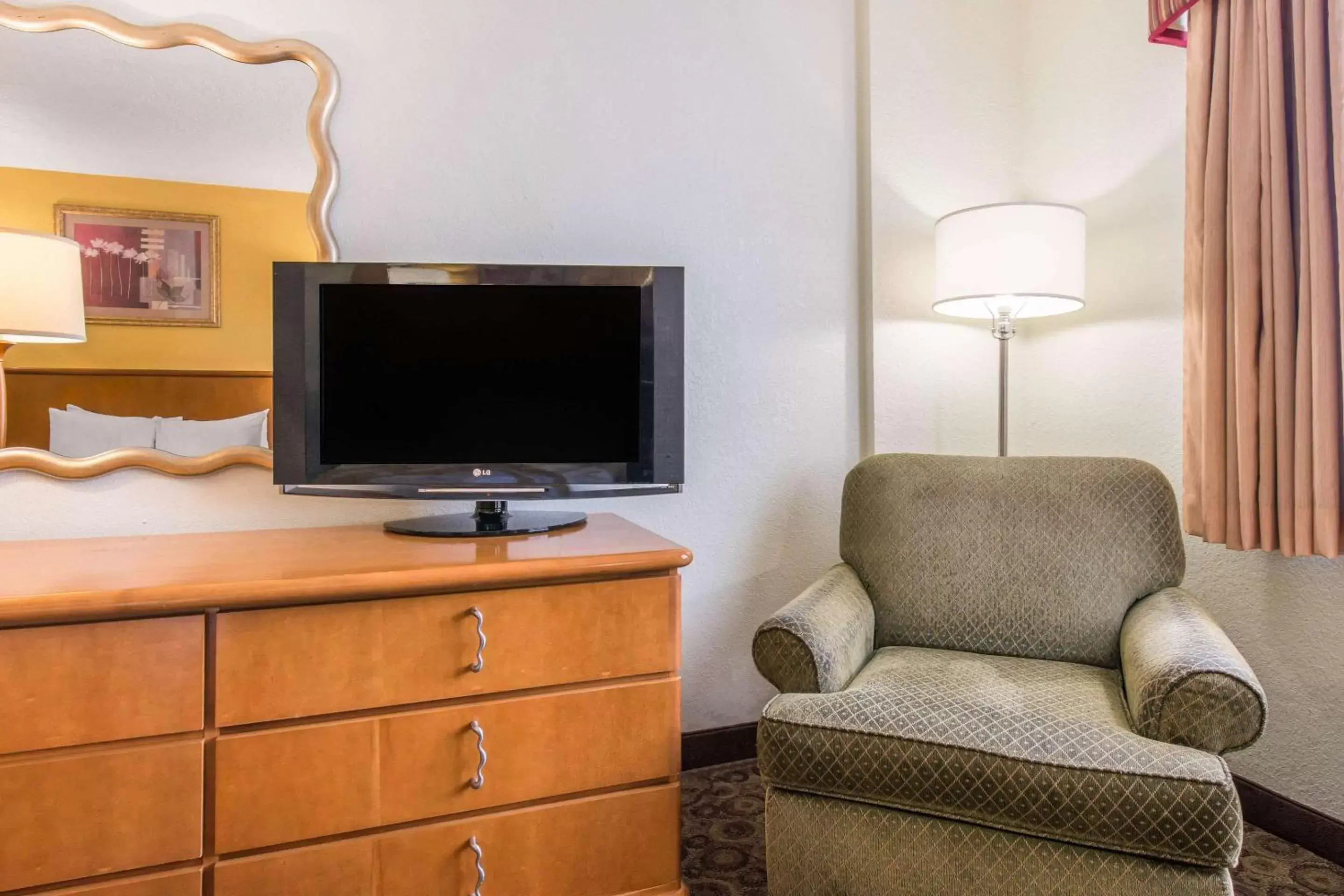 Photo of the whole room, TV/Entertainment Center in Quality Inn & Suites Near the Theme Parks