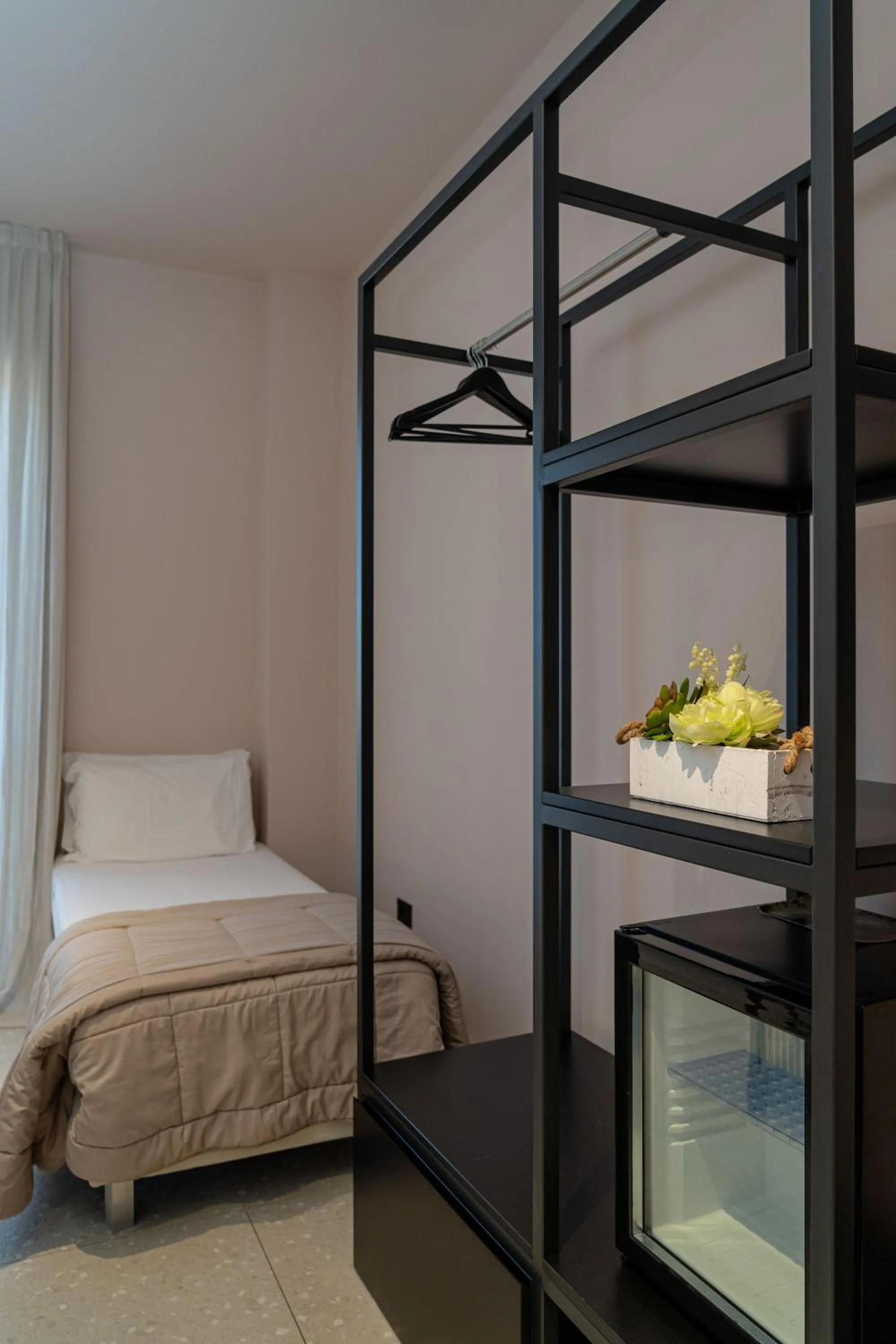 Bed in Elide Design Hotel