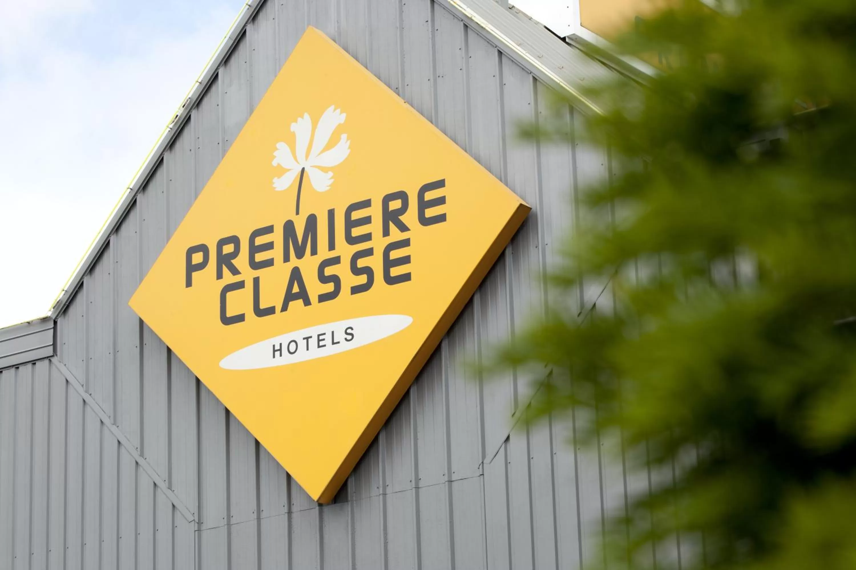 Property logo or sign in Première Classe Clermont-Ferrand Aubière