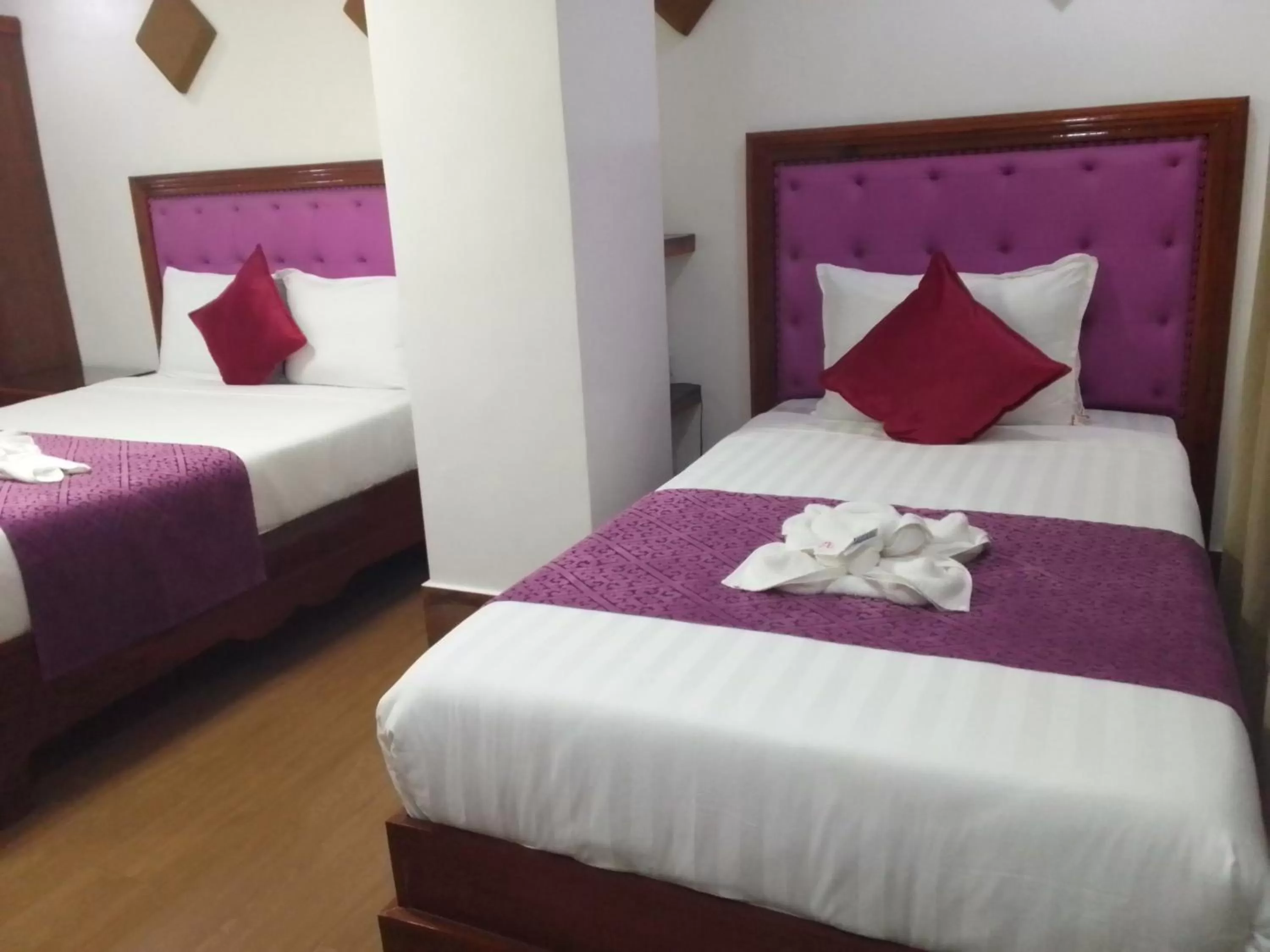 Bed in CLN Boutique Hotel