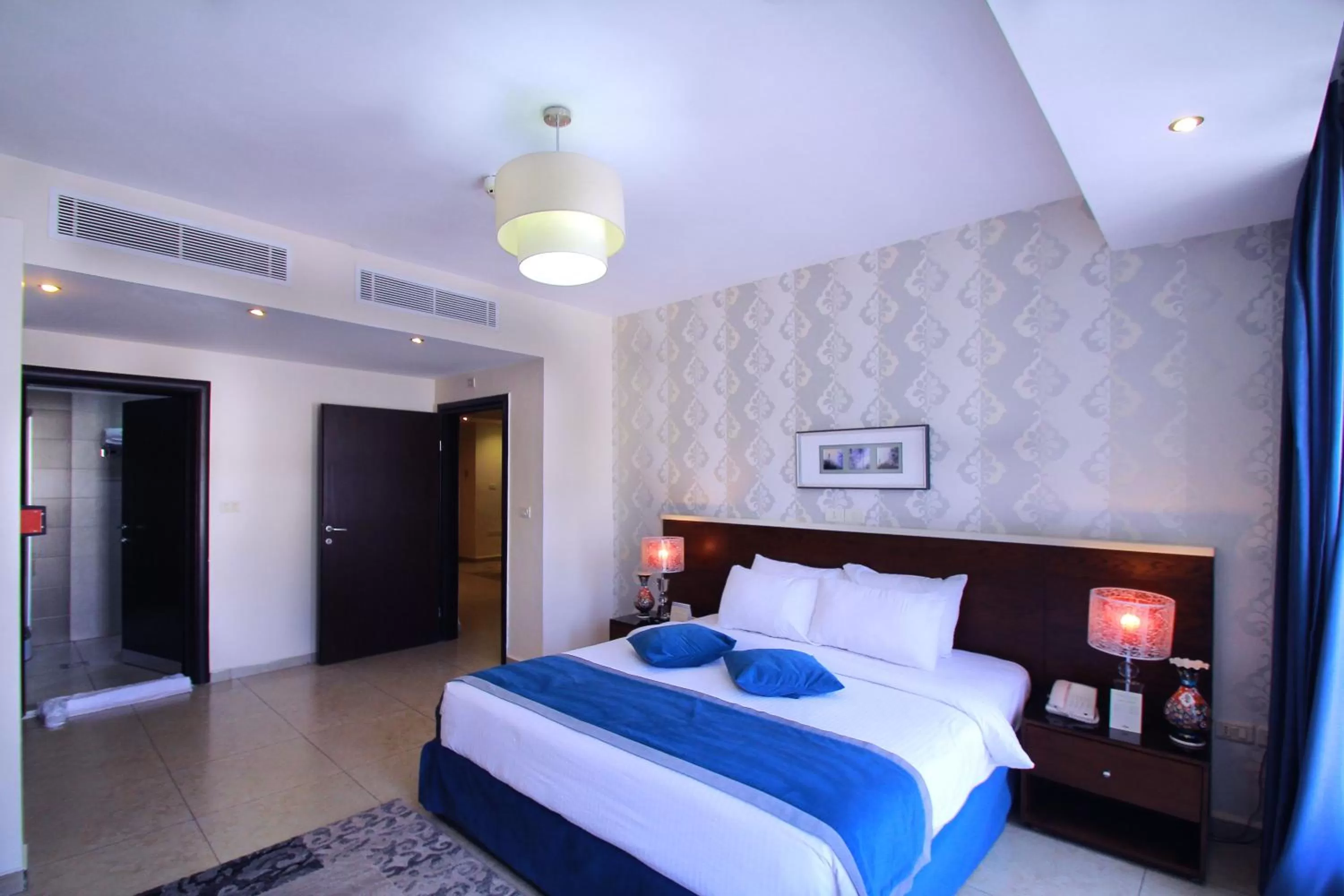 Bed in City Rose Hotel Suites