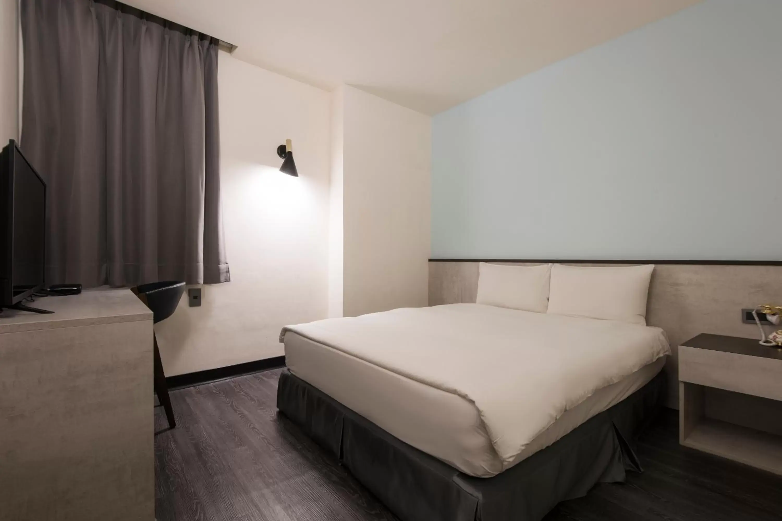 Bed in Raise Hotel Taichung