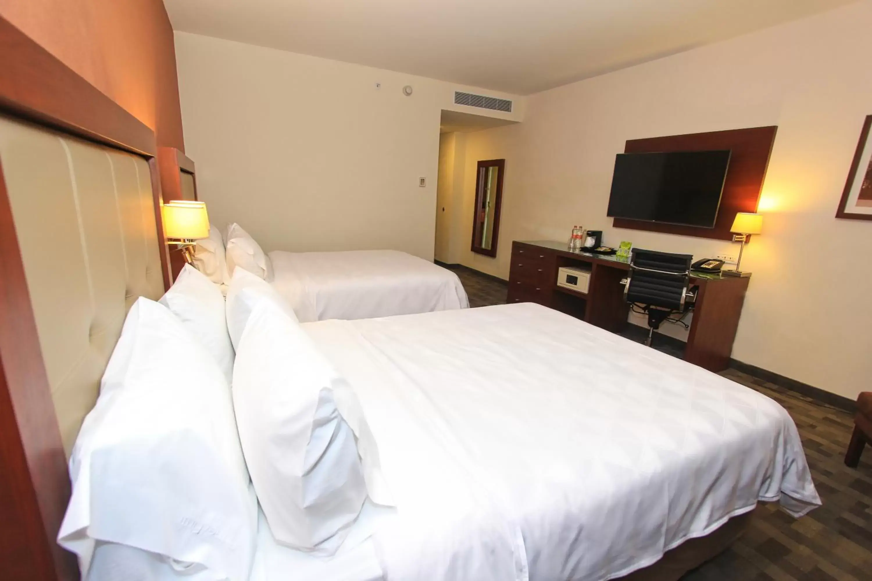 Bed in Holiday Inn & Suites Plaza Mayor, an IHG Hotel