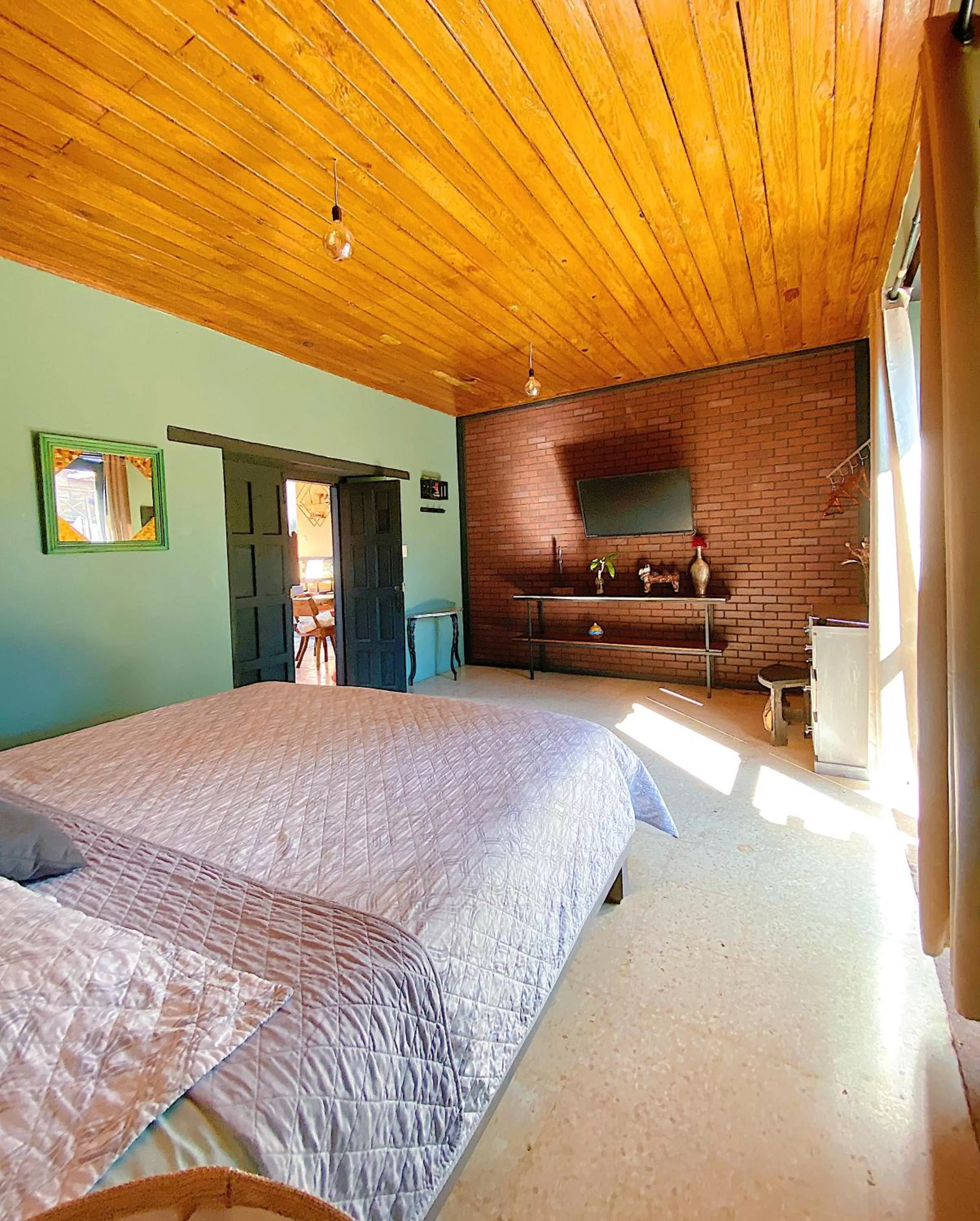 Bed in El Naranjo Hotel Finca Urbana