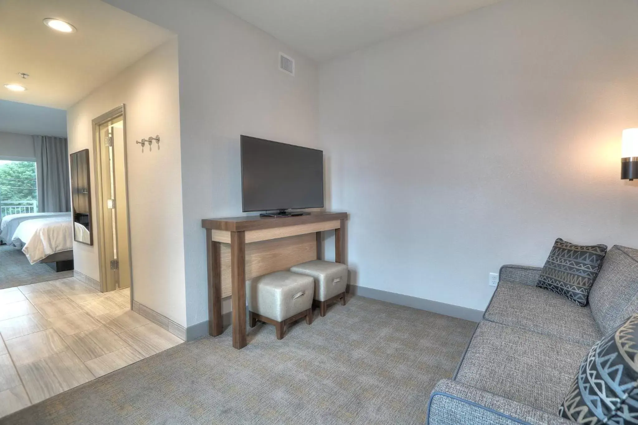 Photo of the whole room, TV/Entertainment Center in Holiday Inn & Suites Pigeon Forge Convention Center, an IHG Hotel