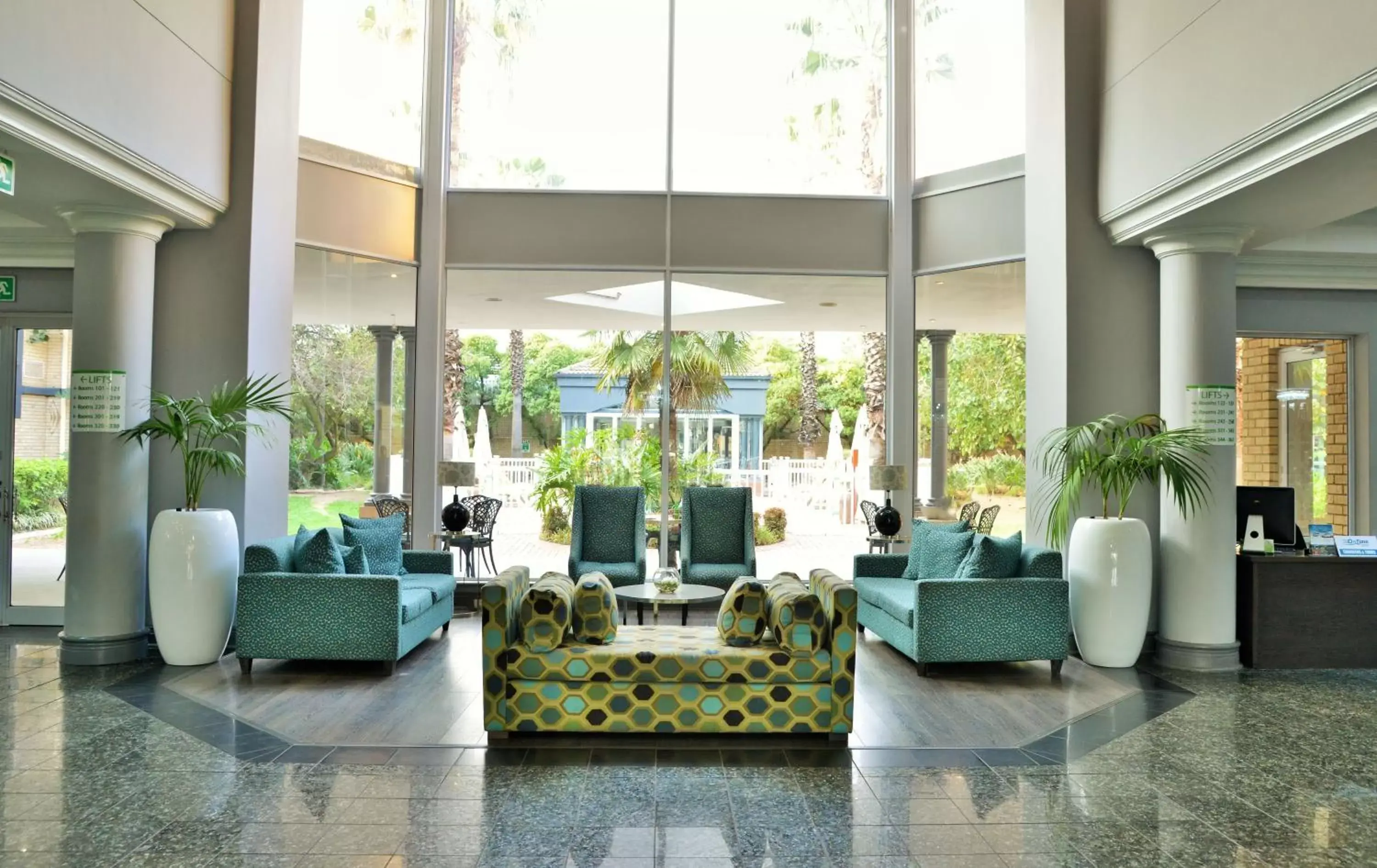 Lobby or reception in Holiday Inn Johannesburg OR Tambo Airport Hotel by IHG Lobby or reception in Holiday Inn Johannesburg OR Tambo Airport Hotel by IHG