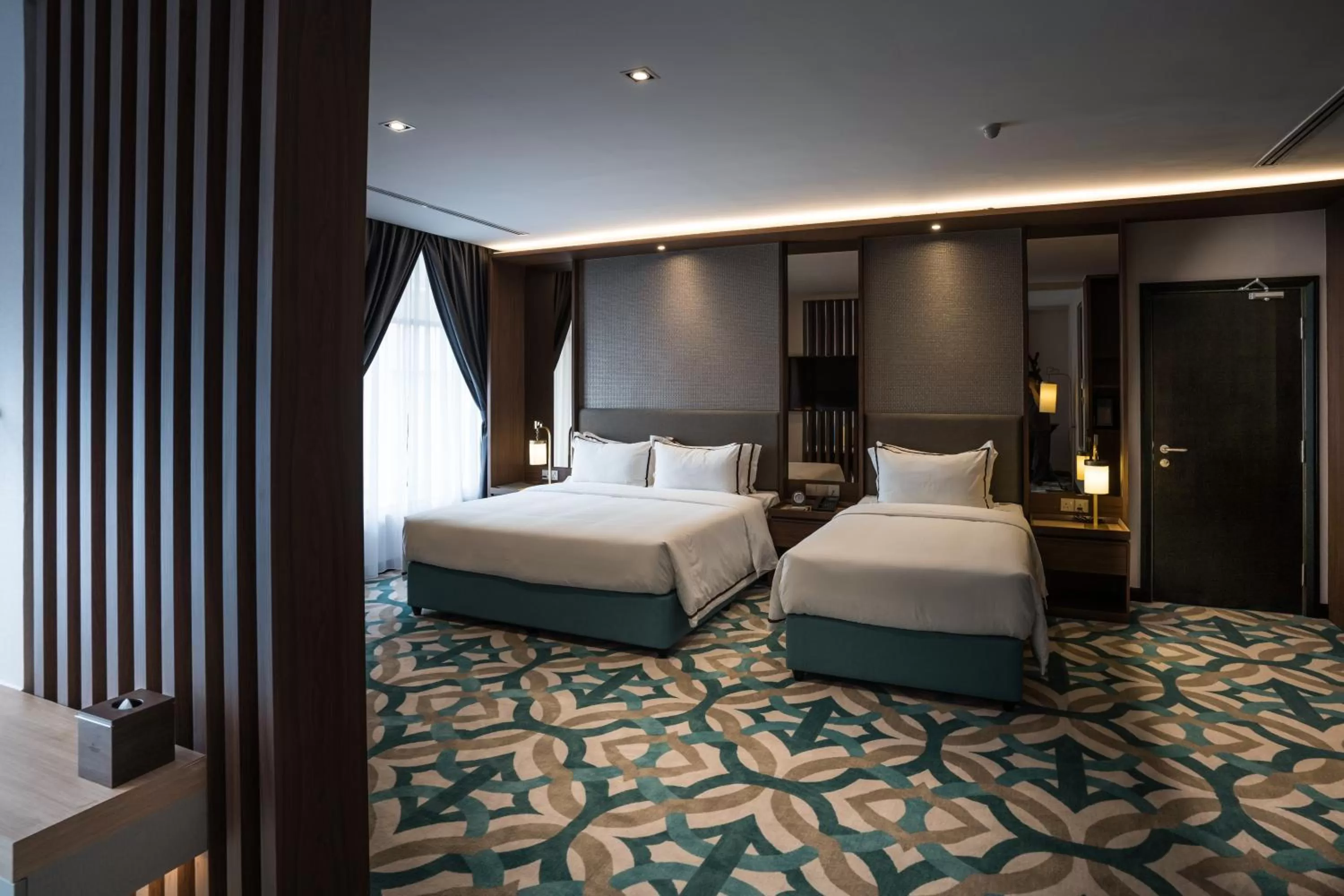 Bed in CHRISTEE SUITES HOTEL