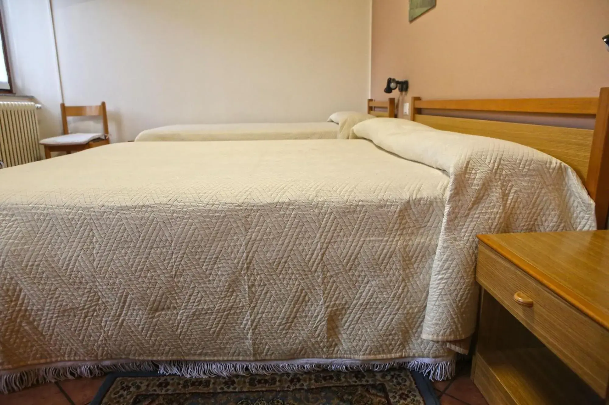 Bed in Albergo Gusmeroli