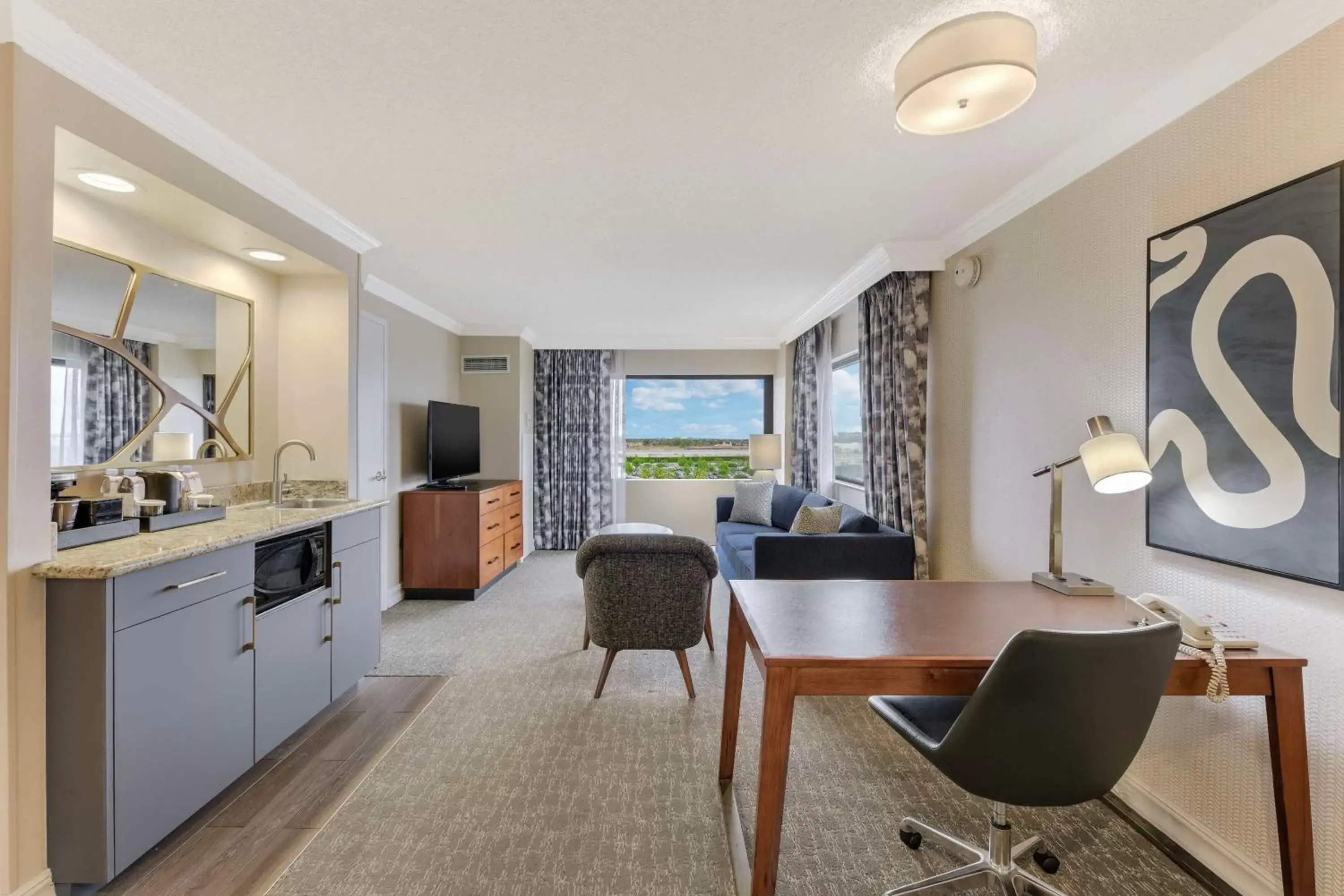 Living room, Kitchen/Kitchenette in Embassy Suites by Hilton Anaheim-Orange