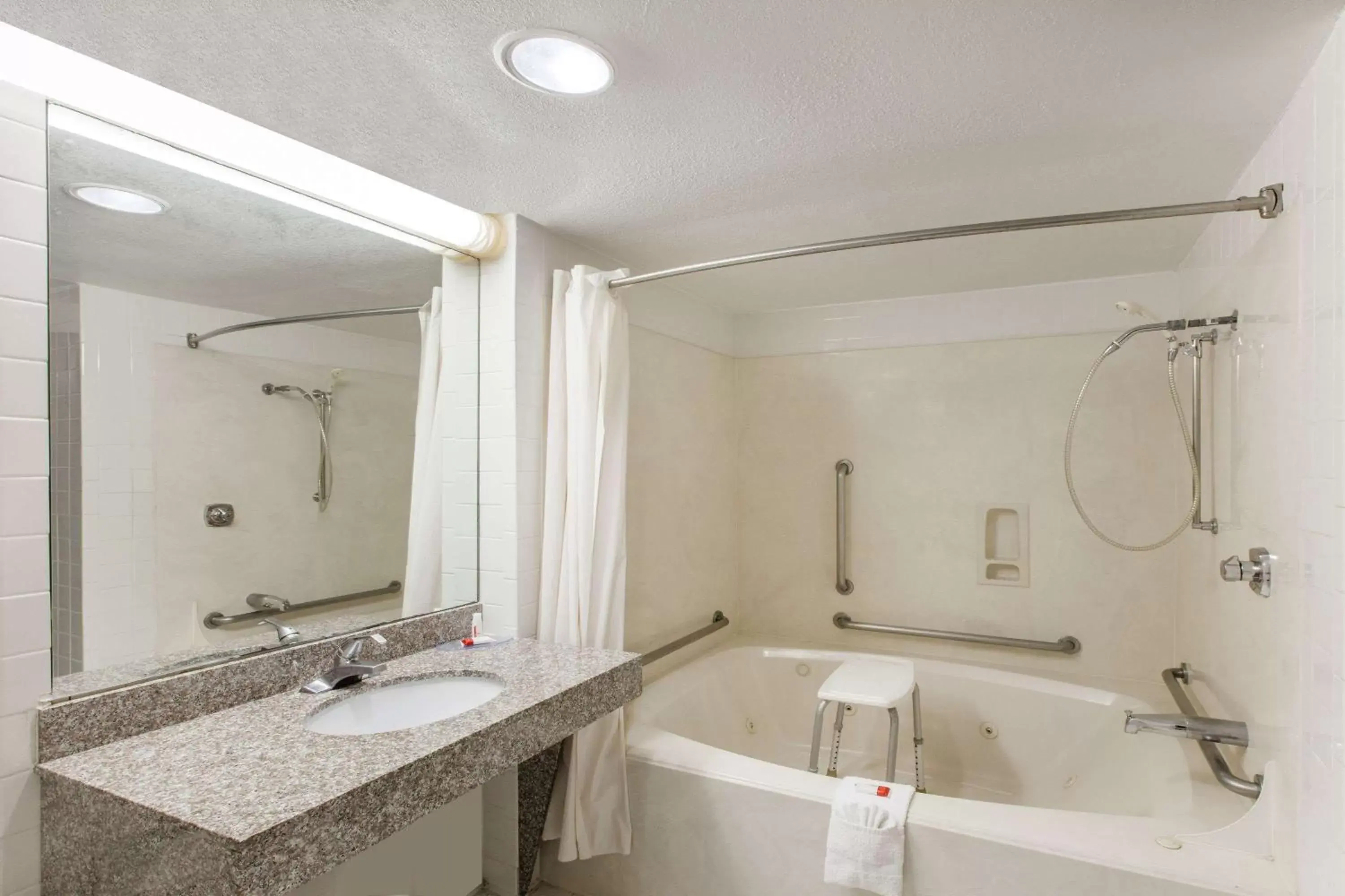 King Room with Bath Tub - Mobility/Hearing Accessible - Smoking in Days Inn & Suites by Wyndham Webster NASA-ClearLake-Houston King Room with Bath Tub - Mobility/Hearing Accessible - Smoking in Days Inn & Suites by Wyndham Webster NASA-ClearLake-Houston