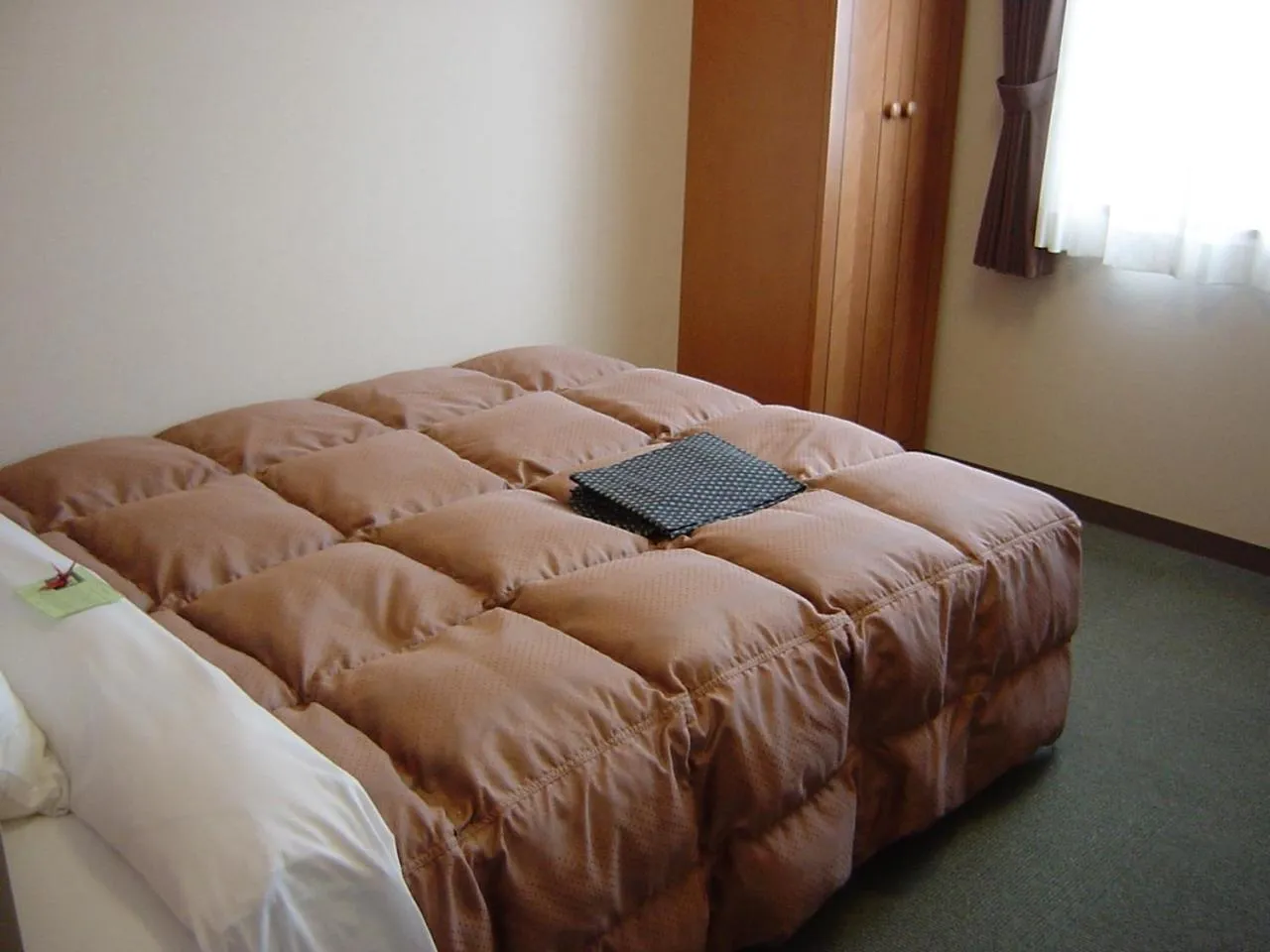 Bed in Hotel Route-Inn Aso Kumamoto Airport Ekimae