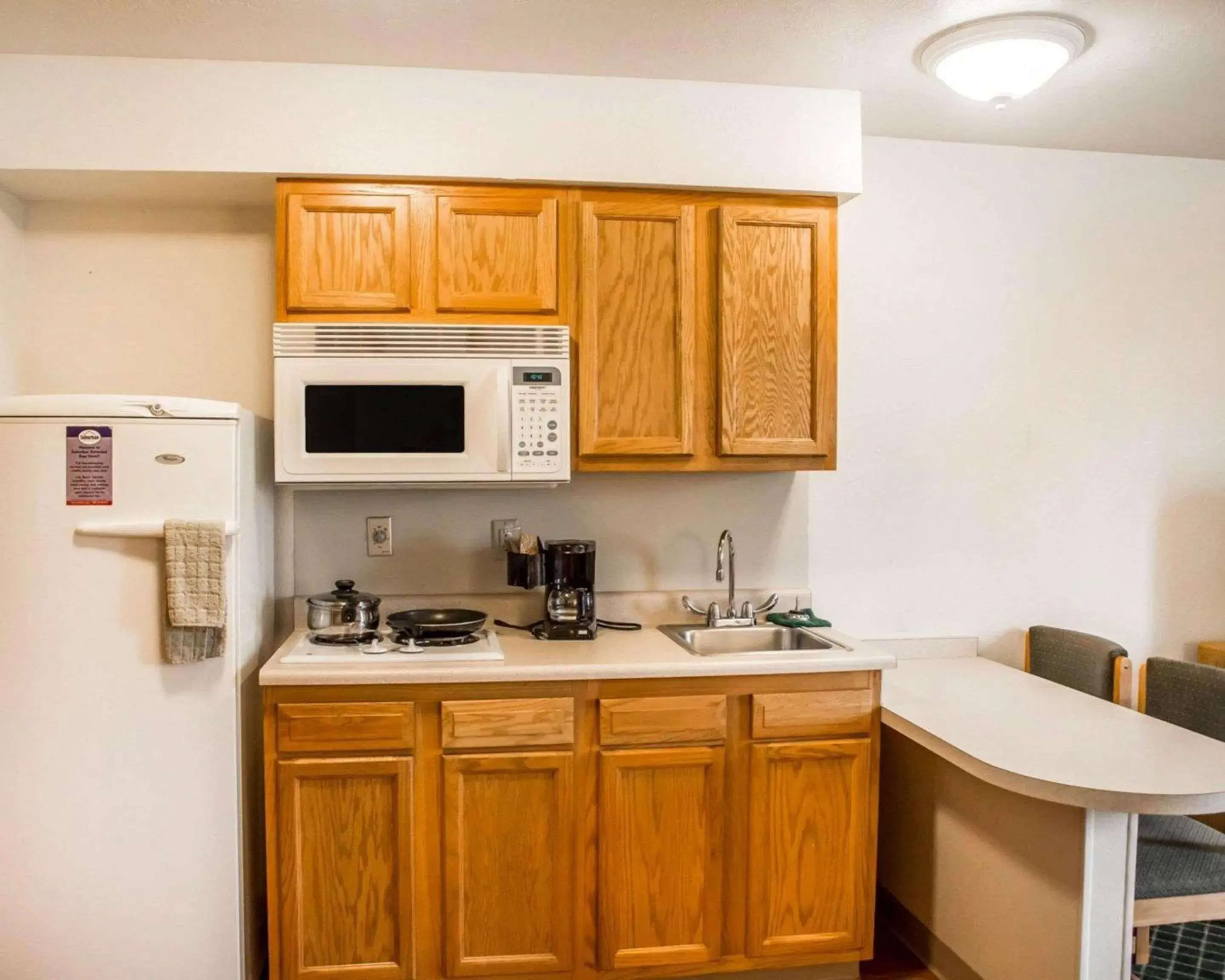 Photo of the whole room, Kitchen/Kitchenette in Suburban Studios Dayton-WP AFB