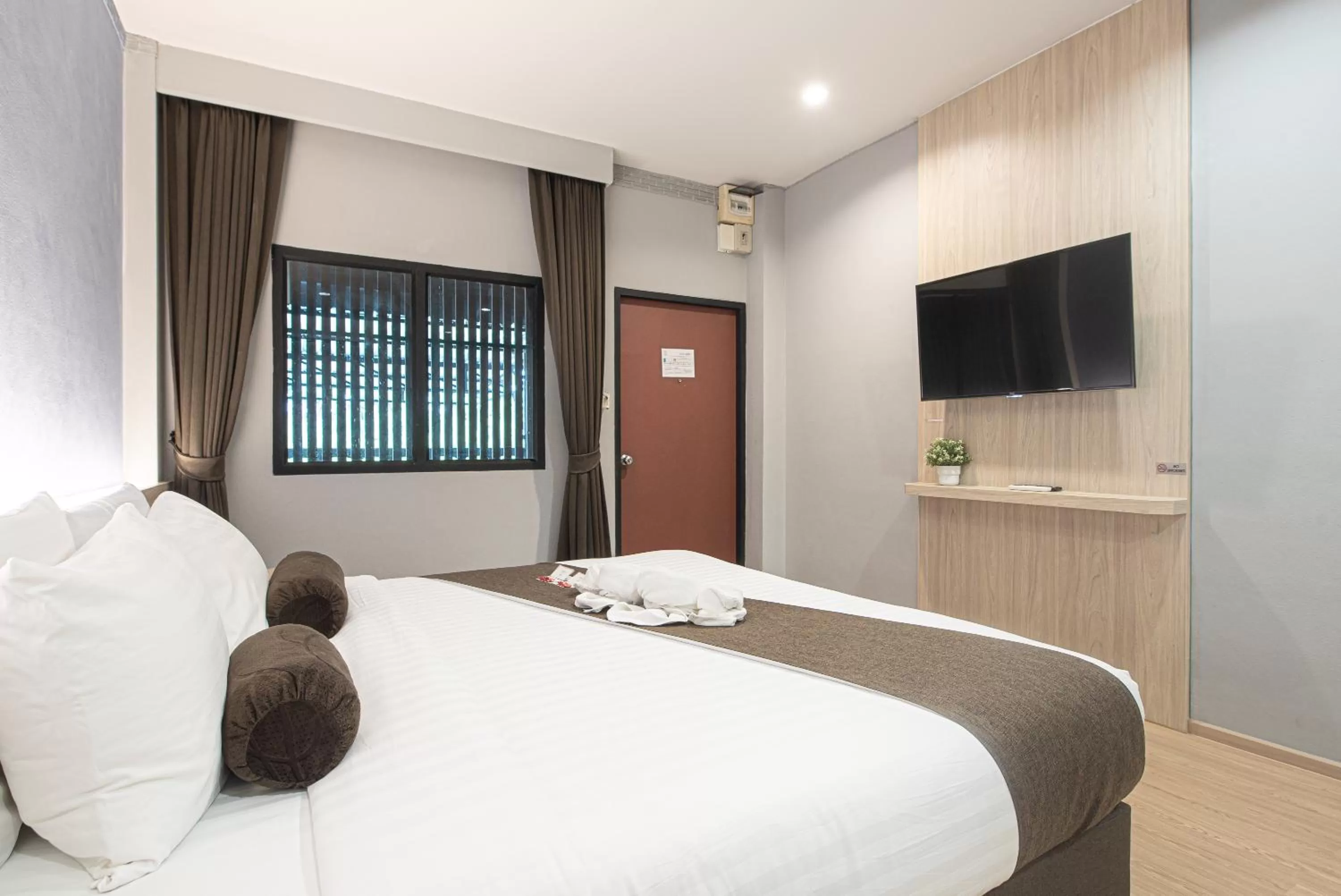 Bed in Tarnsiri Boutique Resort