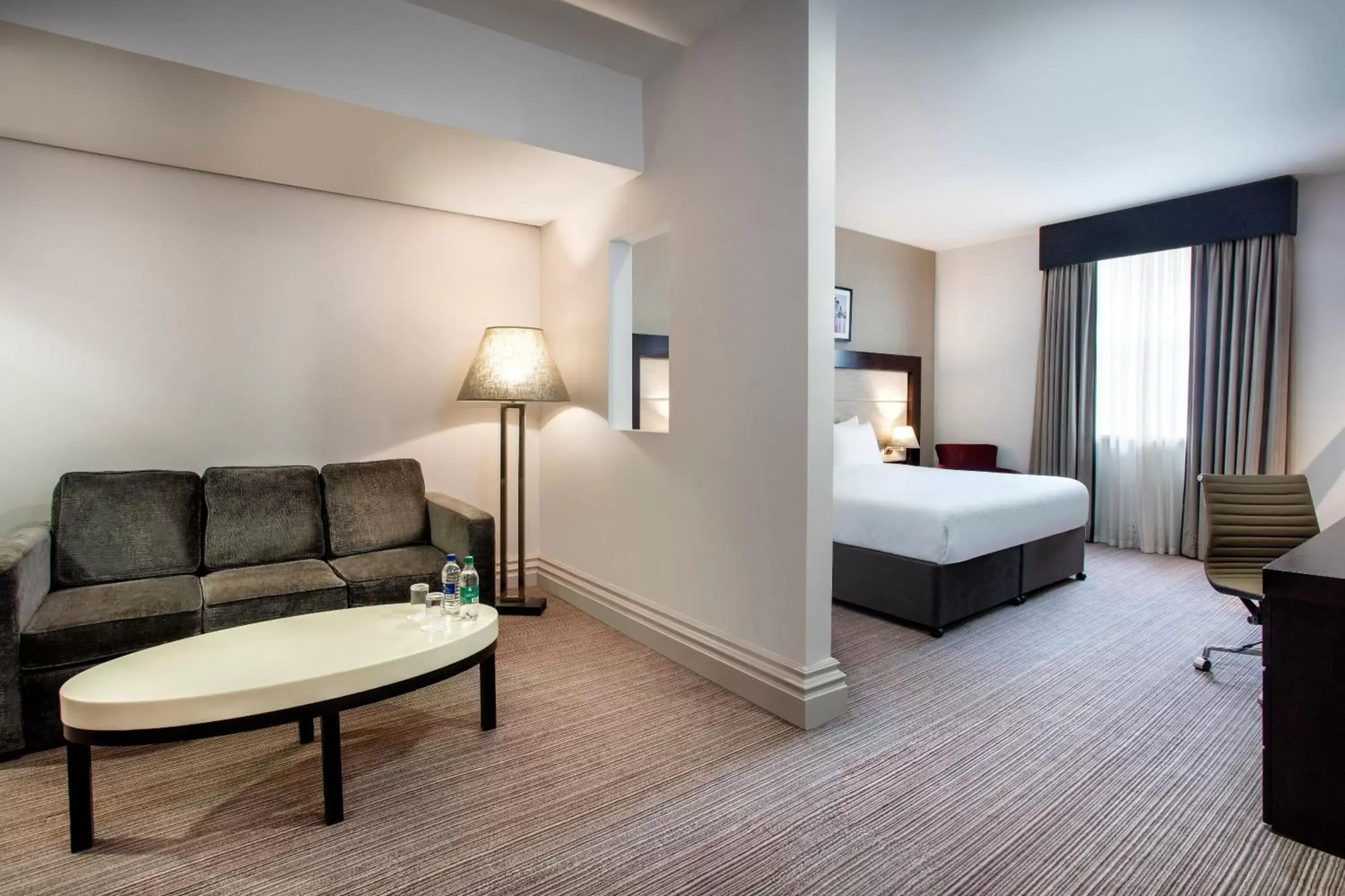 Bed, Seating Area in Leonardo Hotel Cardiff - Formerly Jurys Inn