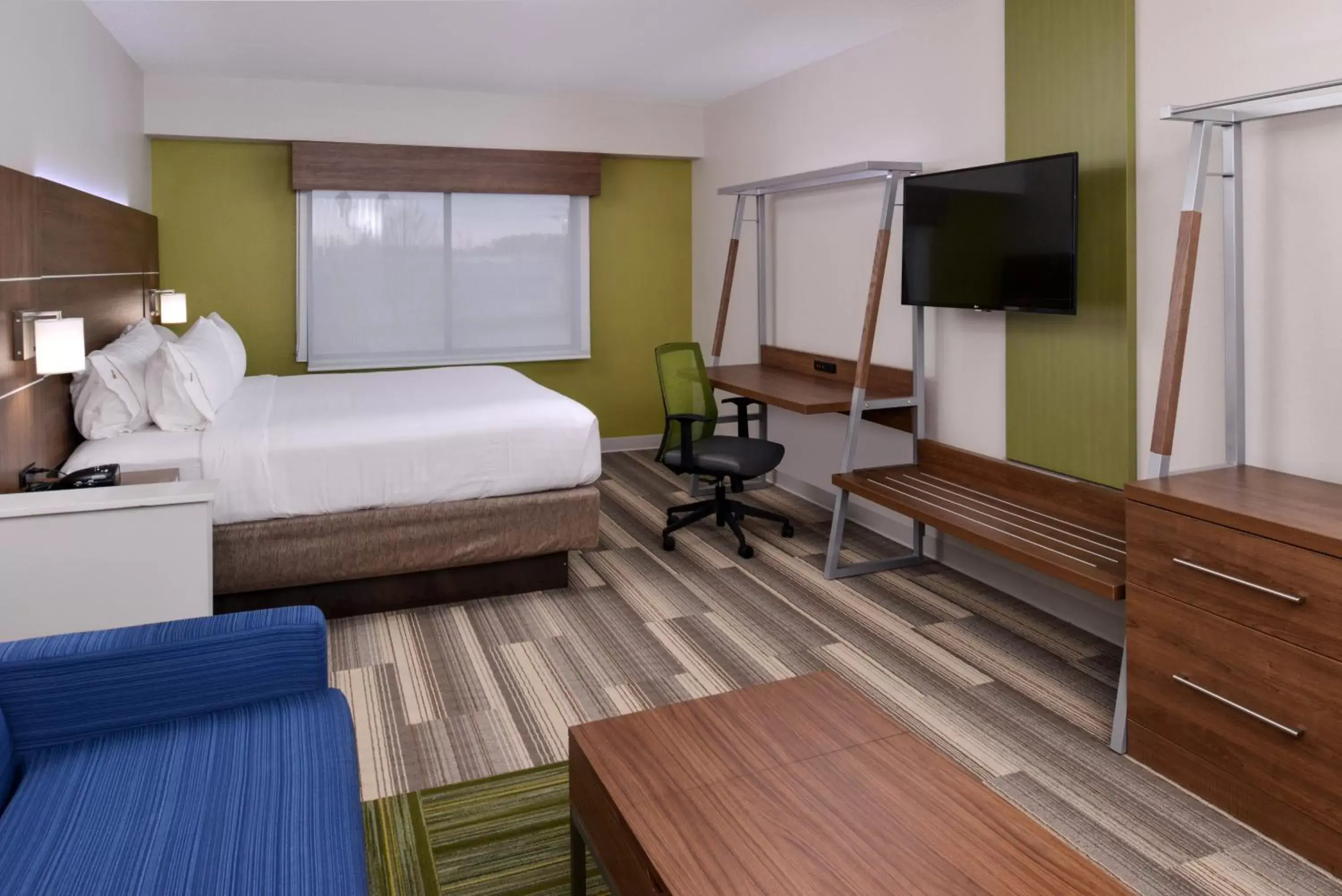 Photo of the whole room, TV/Entertainment Center in Holiday Inn Express & Suites Raleigh NE - Medical Ctr Area, an IHG Hotel