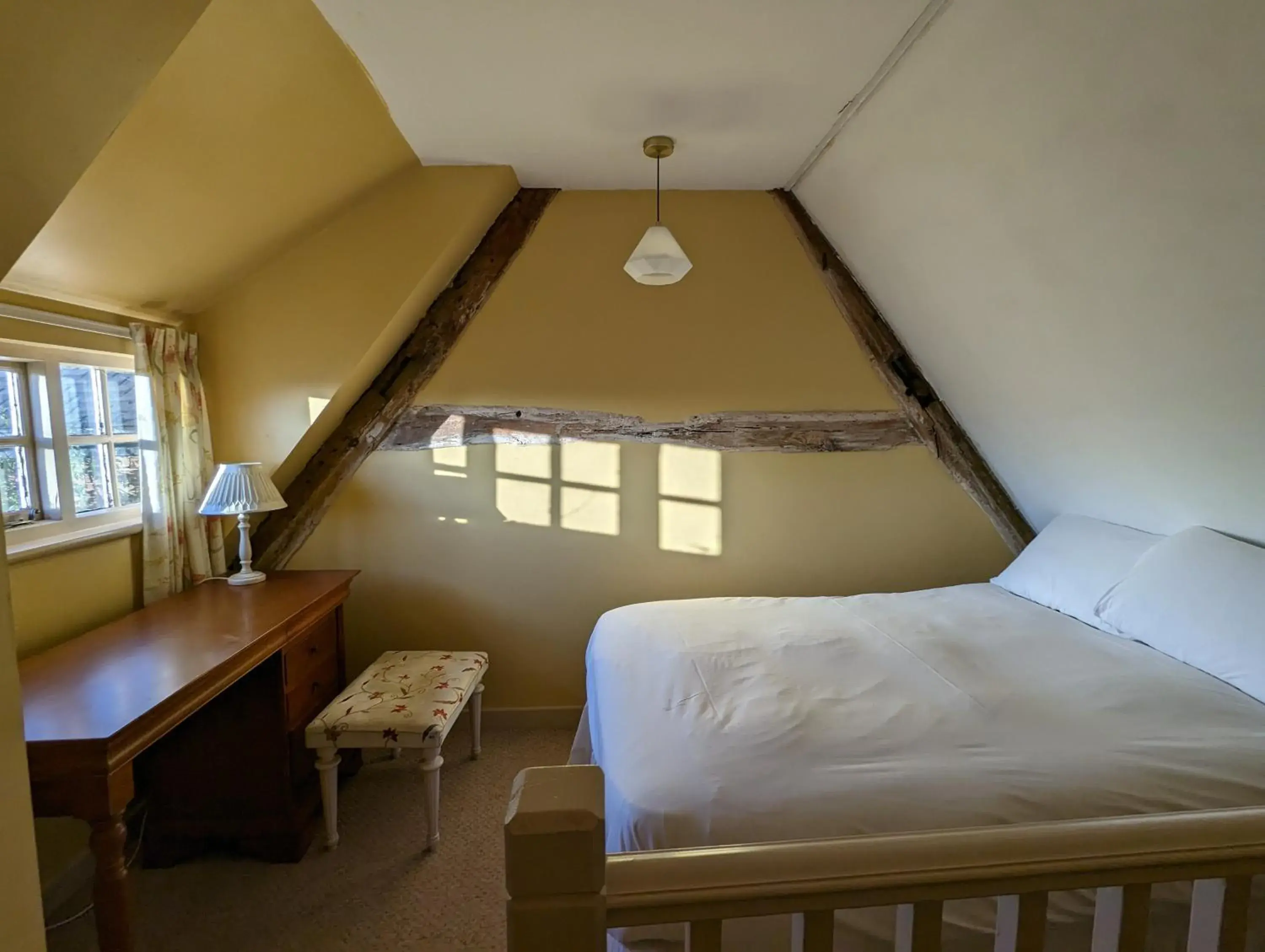Bed in The Cottage Hotel