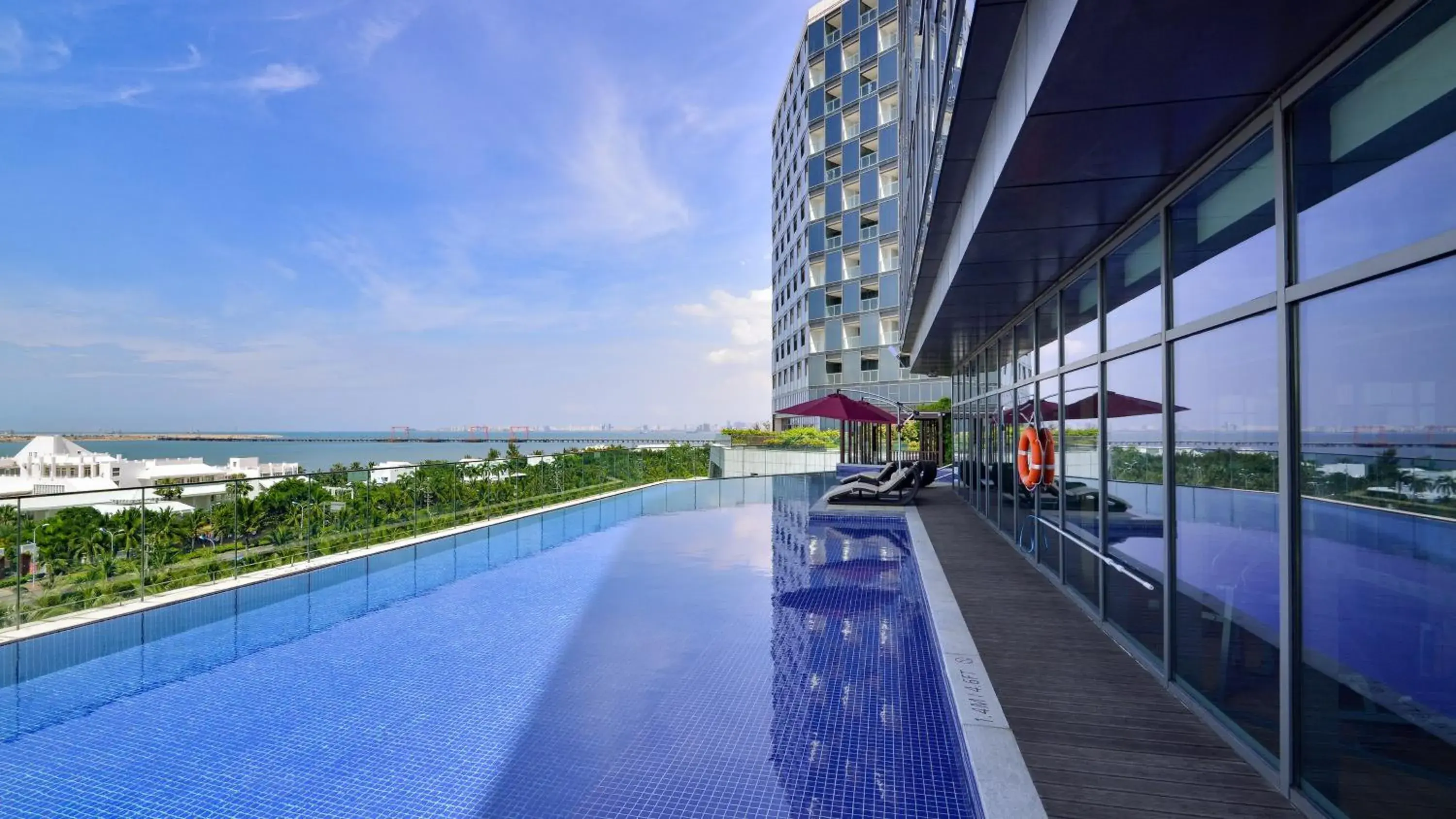 Swimming Pool in Holiday Inn Haikou West Coast, an IHG Hotel