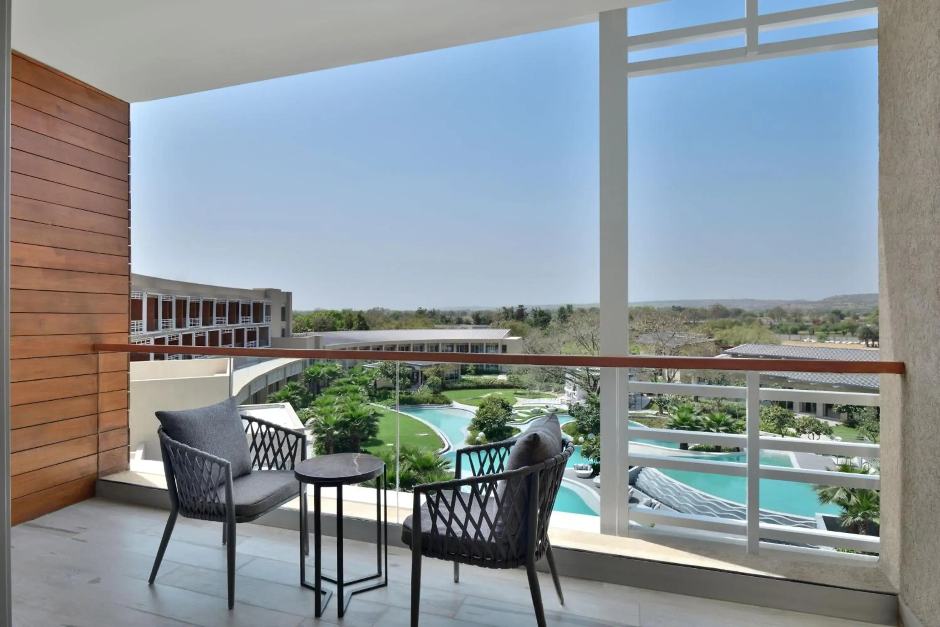 Photo of the whole room, Pool View in Courtyard by Marriott Aravali Resort