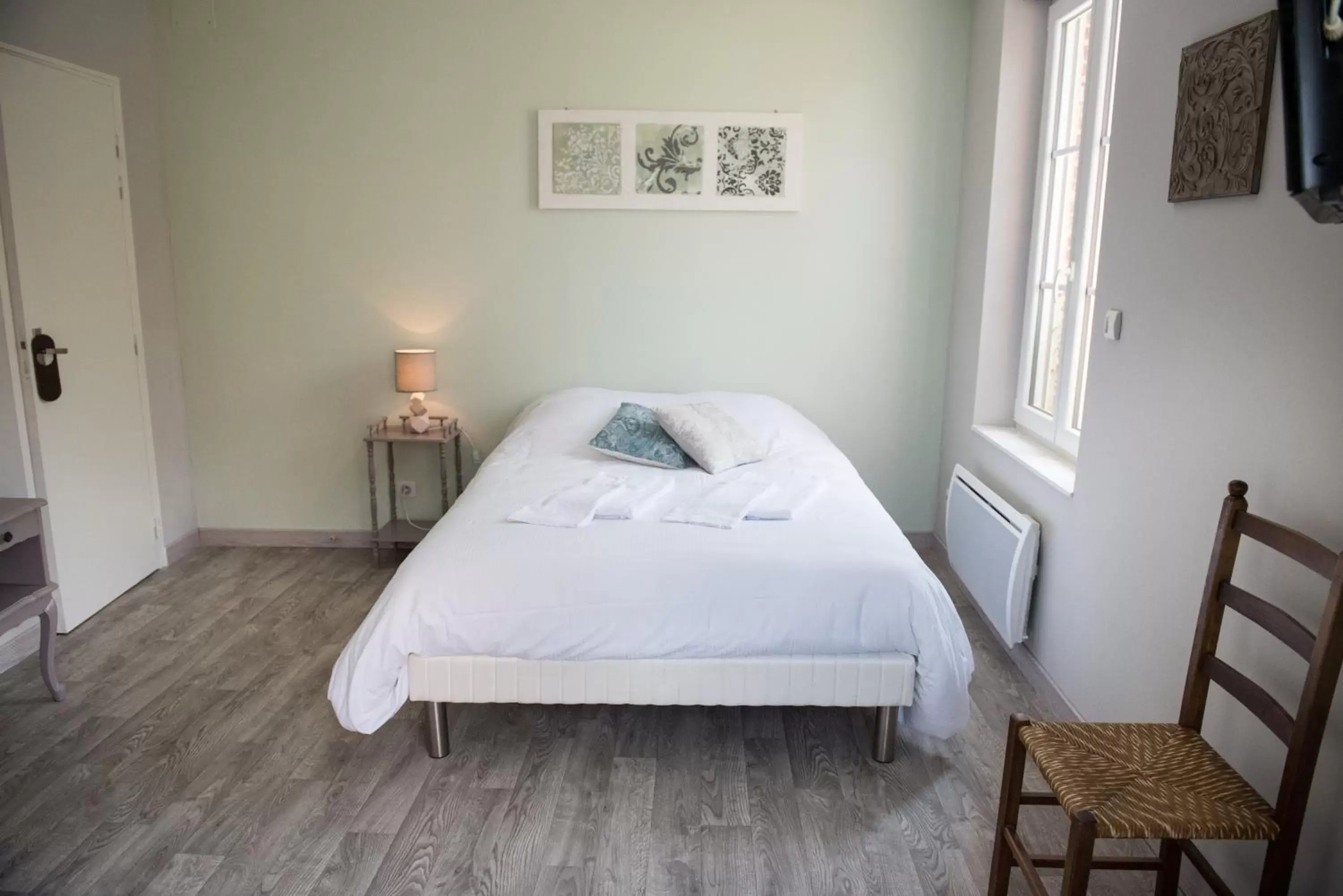 Photo of the whole room, Bed in Logis Hotel Restaurant Le Relais Fleuri Photo of the whole room, Bed in Logis Hotel Restaurant Le Relais Fleuri