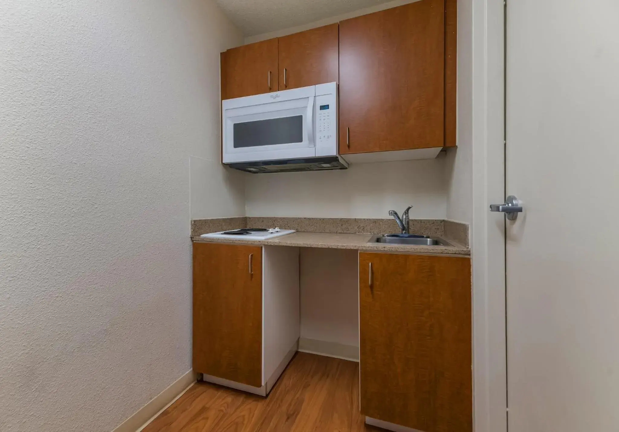 Kitchen or kitchenette, Kitchen/Kitchenette in HomeTowne Studios by Red Roof Orlando - UCF Area