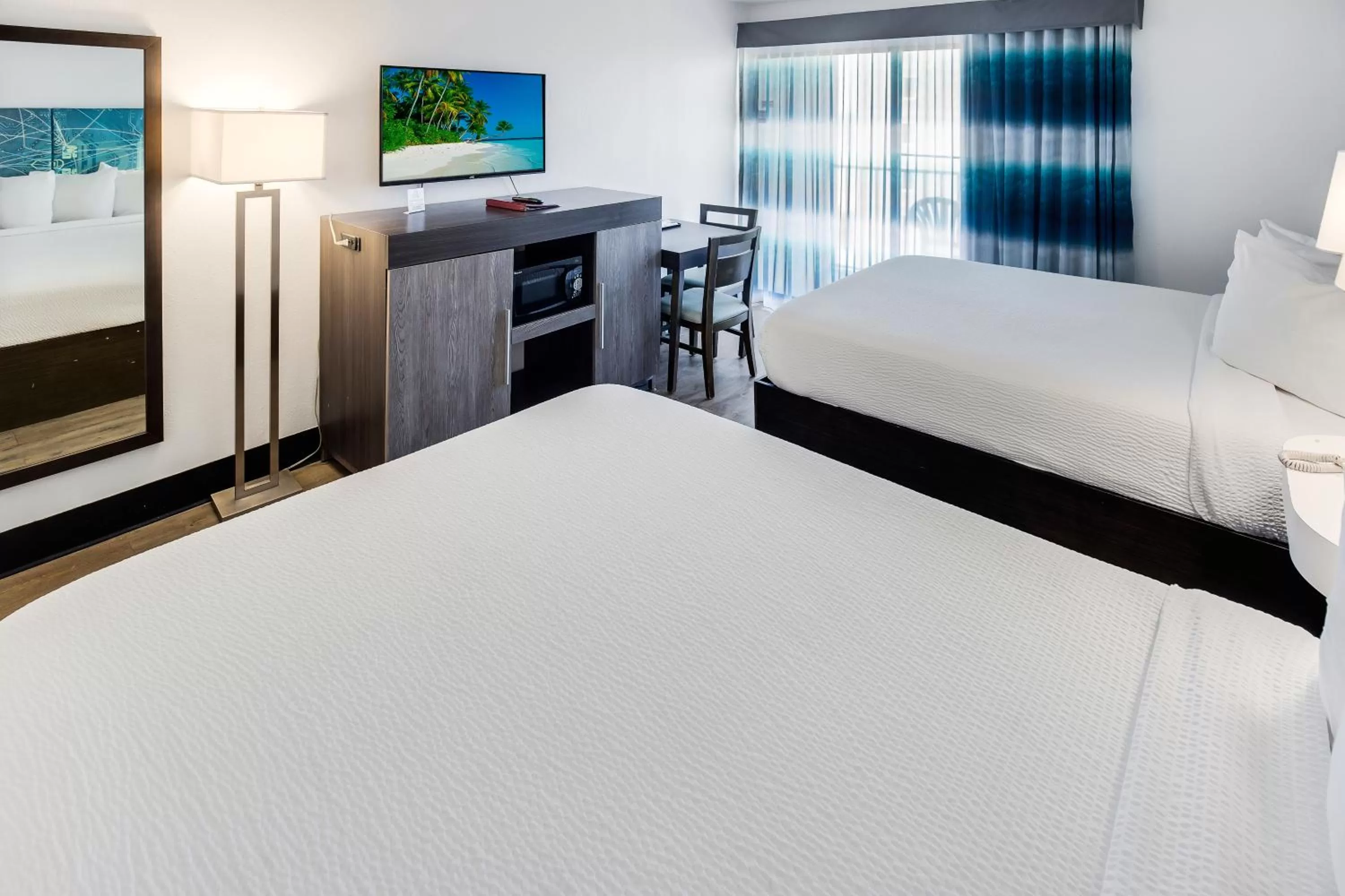 Bed in Tropical Seas Hotel