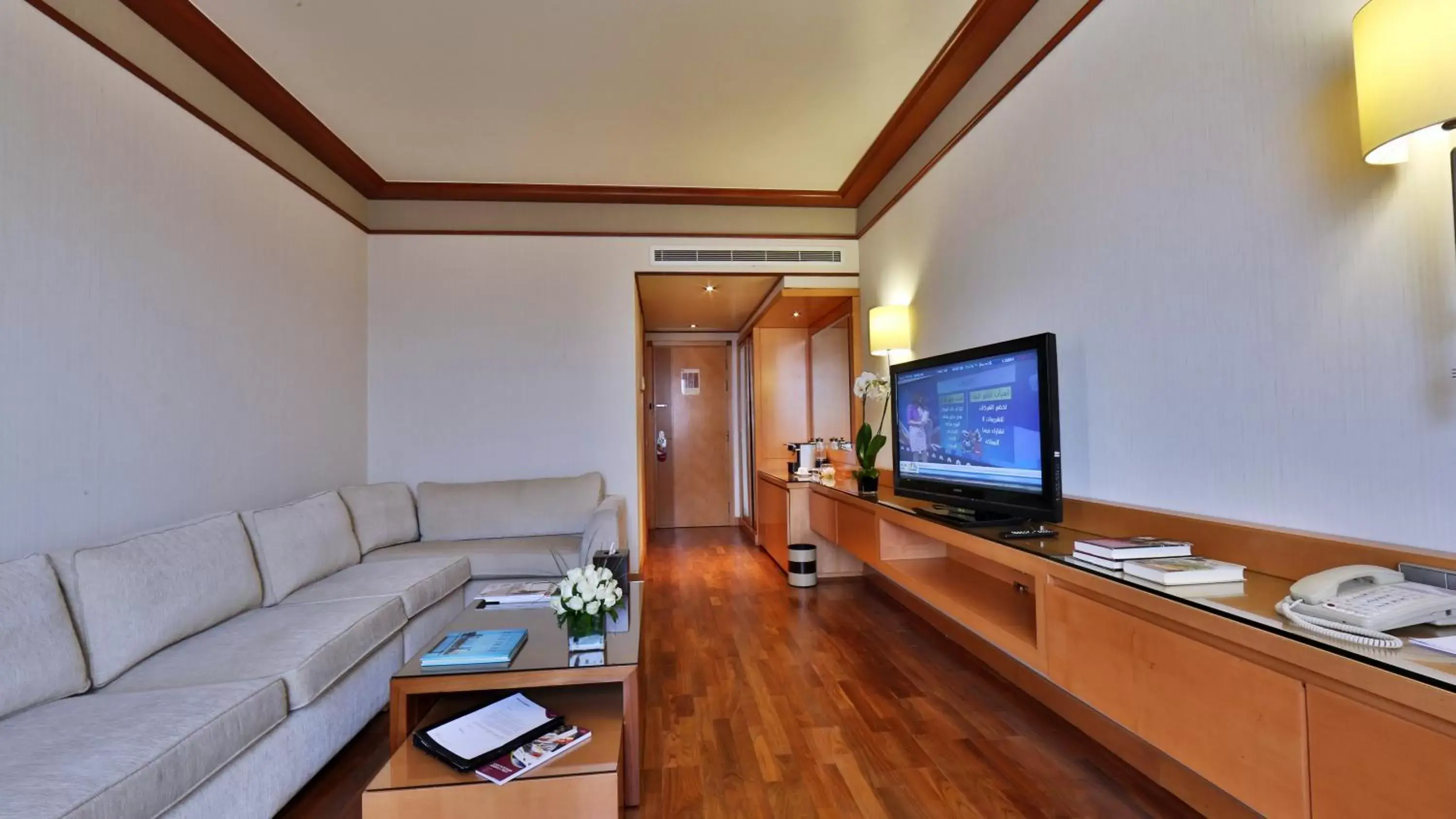 Photo of the whole room, TV/Entertainment Center in Crowne Plaza Hamra Beirut, an IHG Hotel