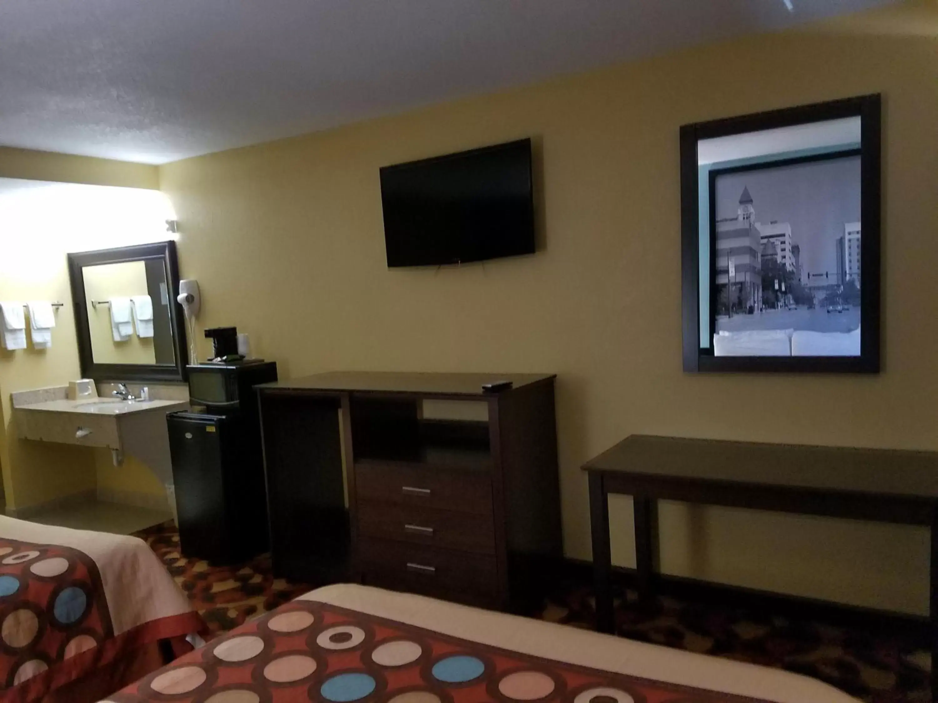 Photo of the whole room, TV/Entertainment Center in Super 8 by Wyndham Wichita Airport West Kellogg