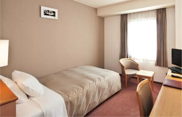 Bed in Ishinomaki Grand Hotel