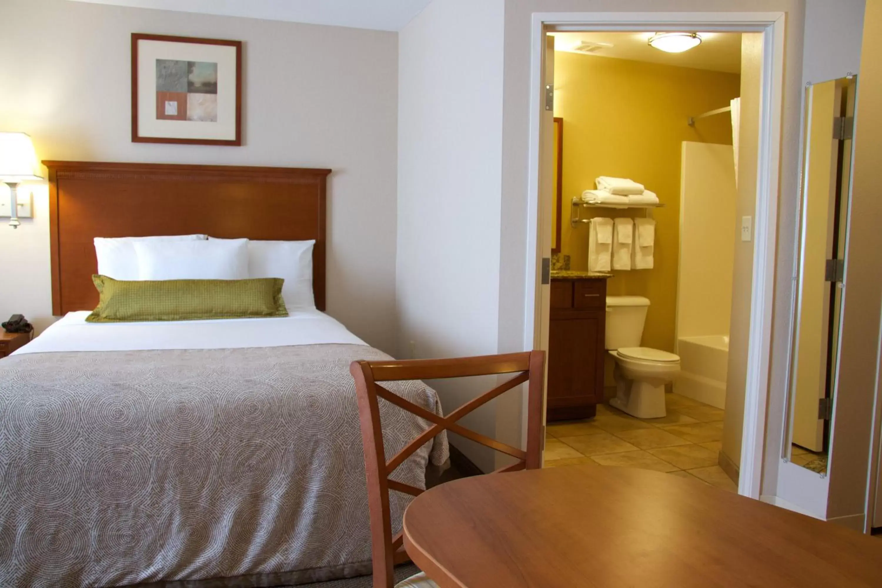 Photo of the whole room, Bed in Candlewood Suites Champaign-Urbana University Area, an IHG Hotel