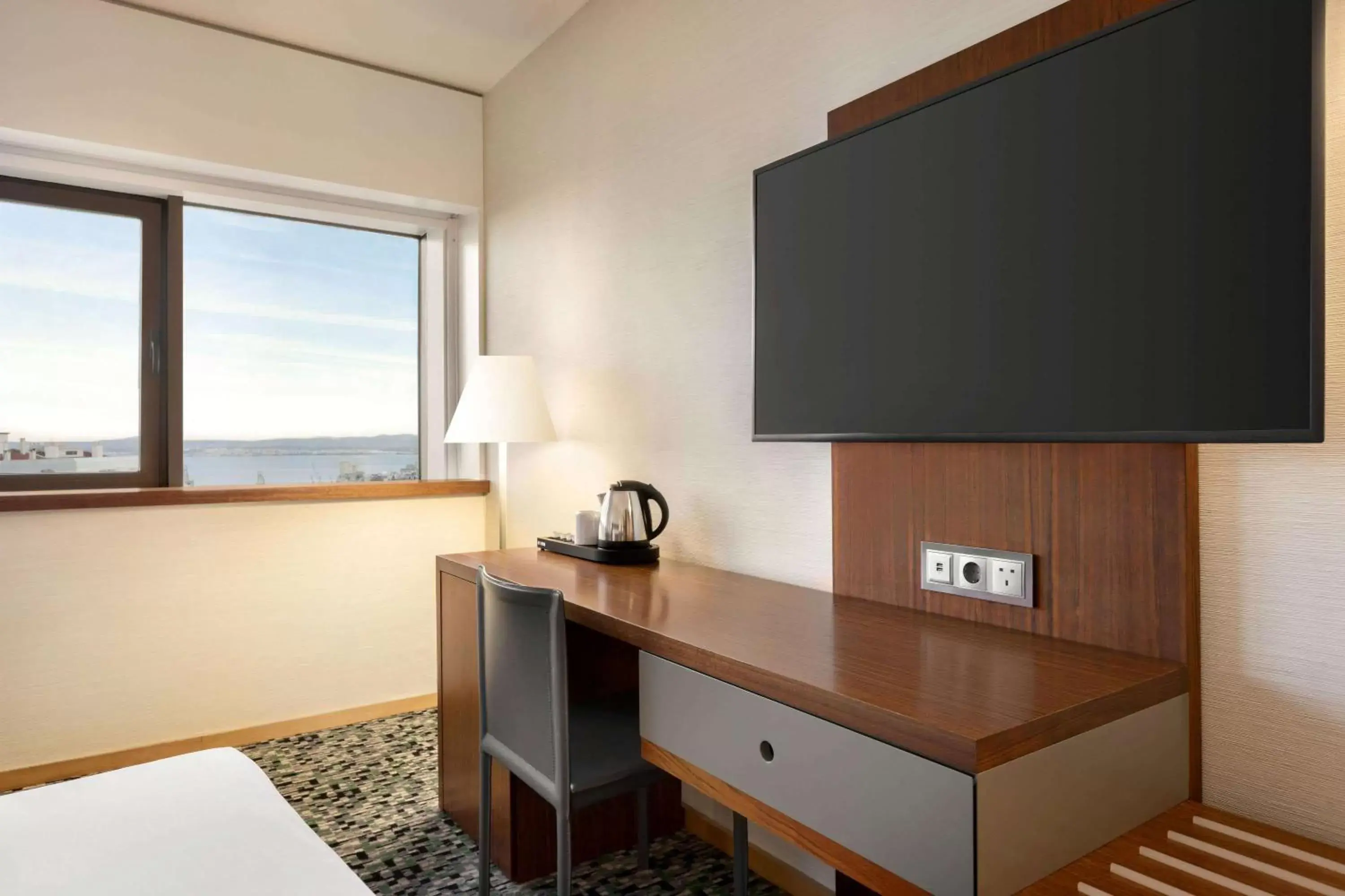 Photo of the whole room, TV/Entertainment Center in Ramada by Wyndham Lisbon