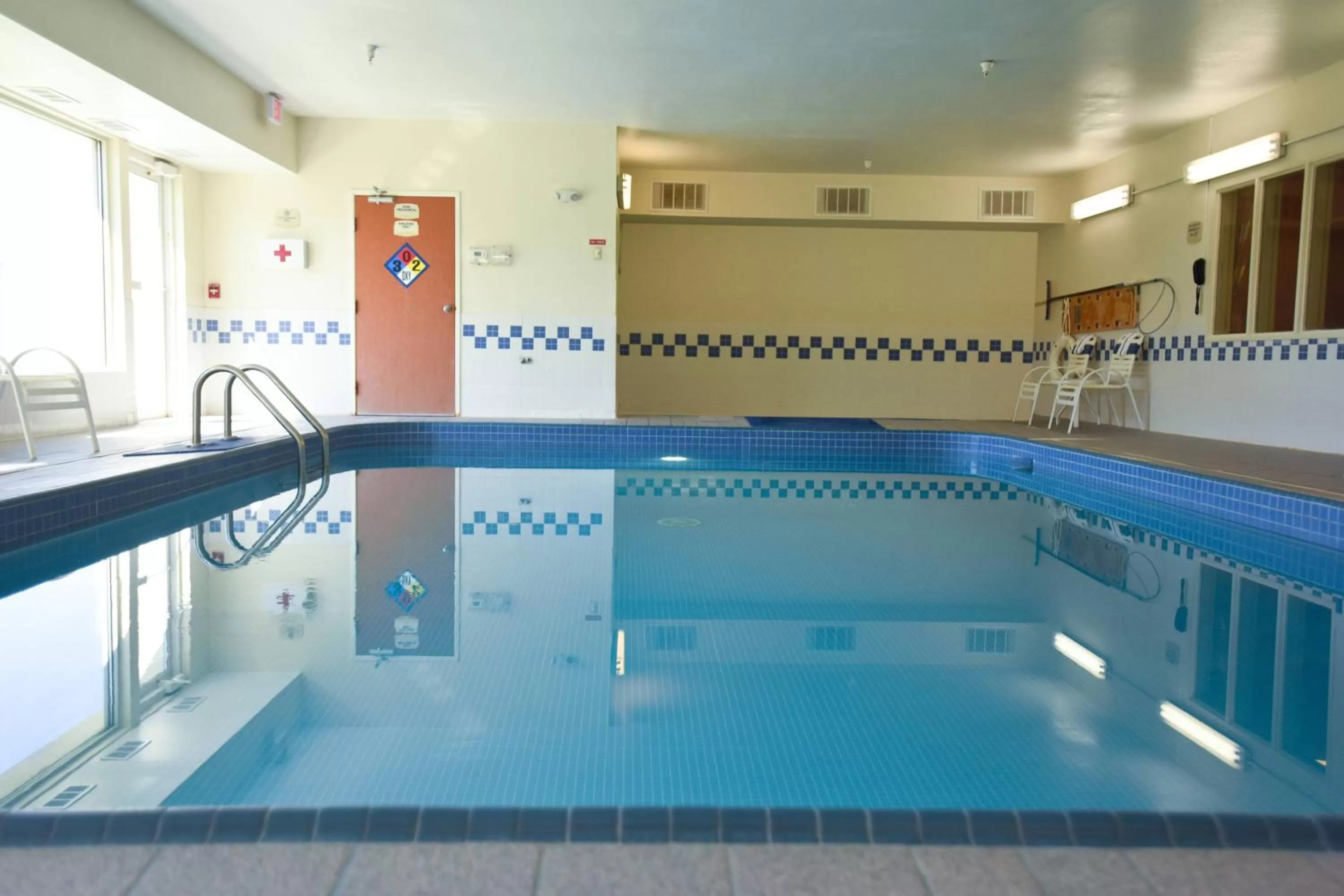Swimming pool in AmericInn by Wyndham Topeka