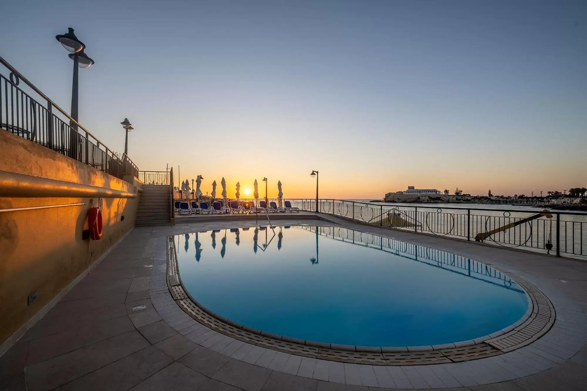 Swimming pool, Sunrise/Sunset in Marina Hotel Corinthia Beach Resort Malta