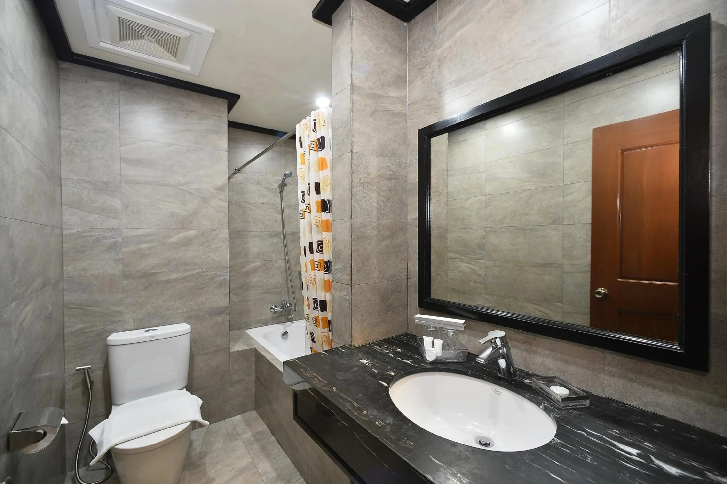Bathroom in Paragon Hotel and Suites