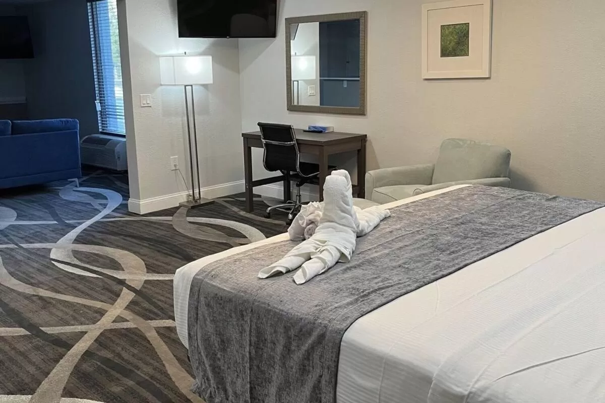 Bed in Opal Hotel & Suites