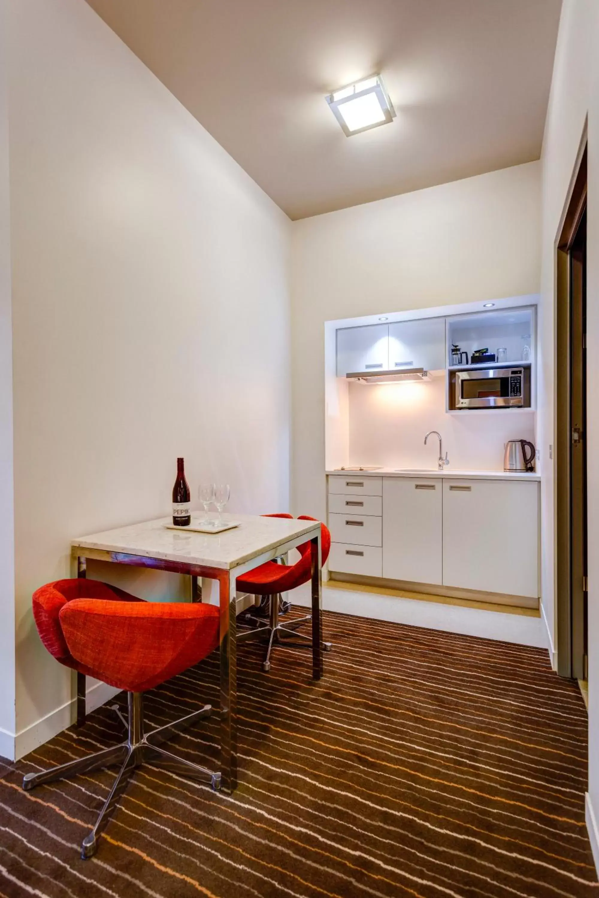 Kitchen or kitchenette, Dining Area in Mantra Charles Hotel