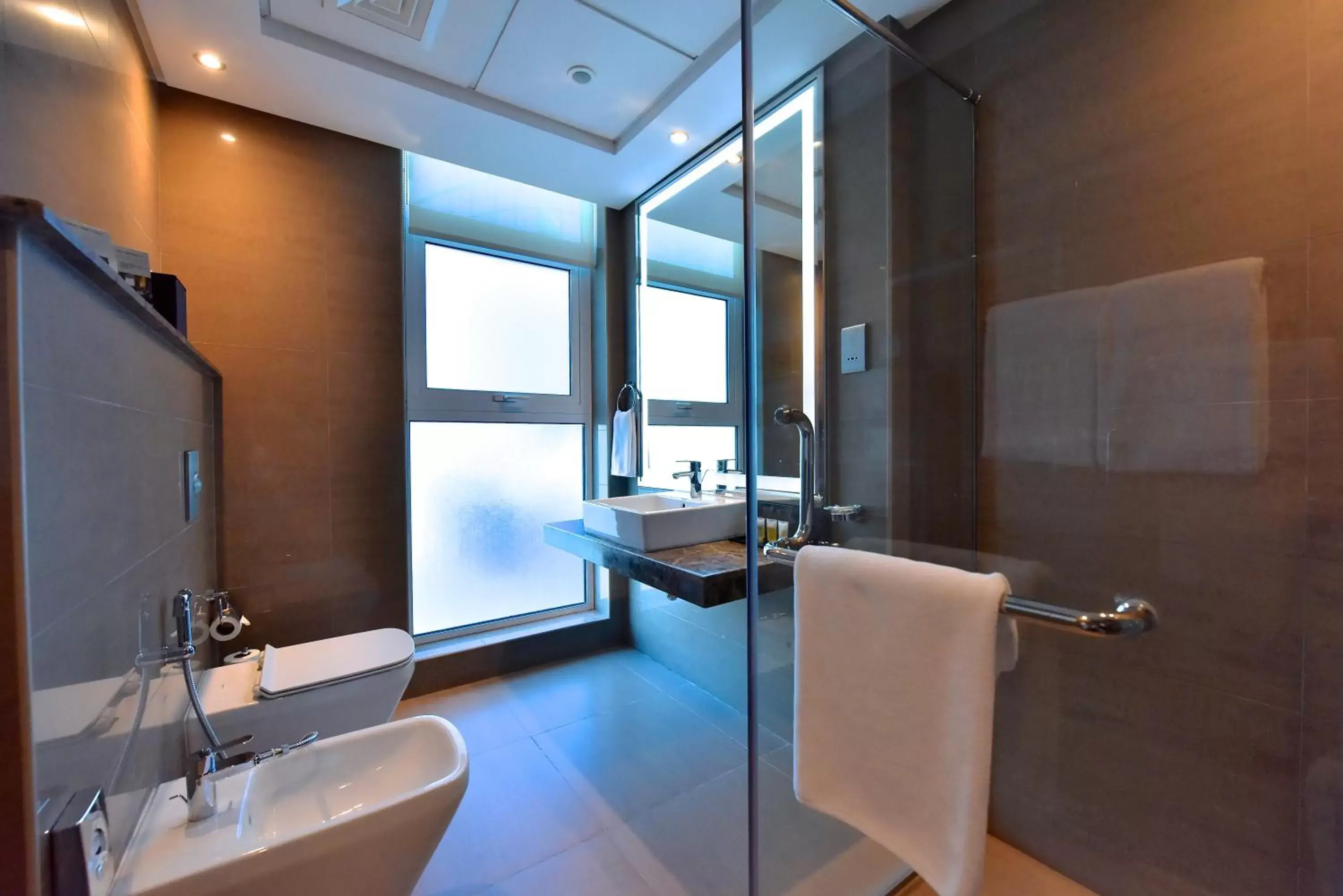 Shower, Bathroom in Ramada by Wyndham Manama City Centre