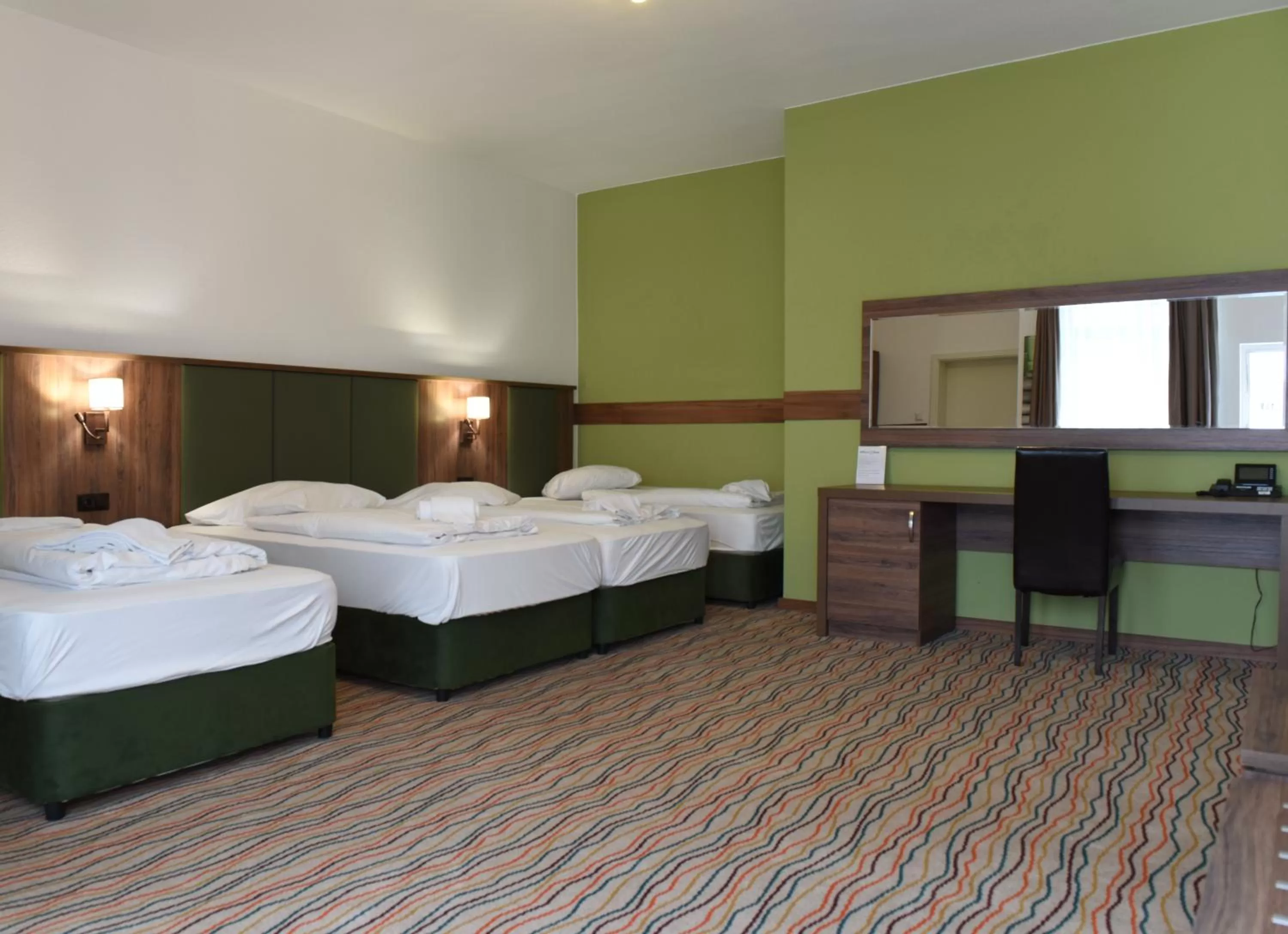 Bed in Hotel Olive Inn