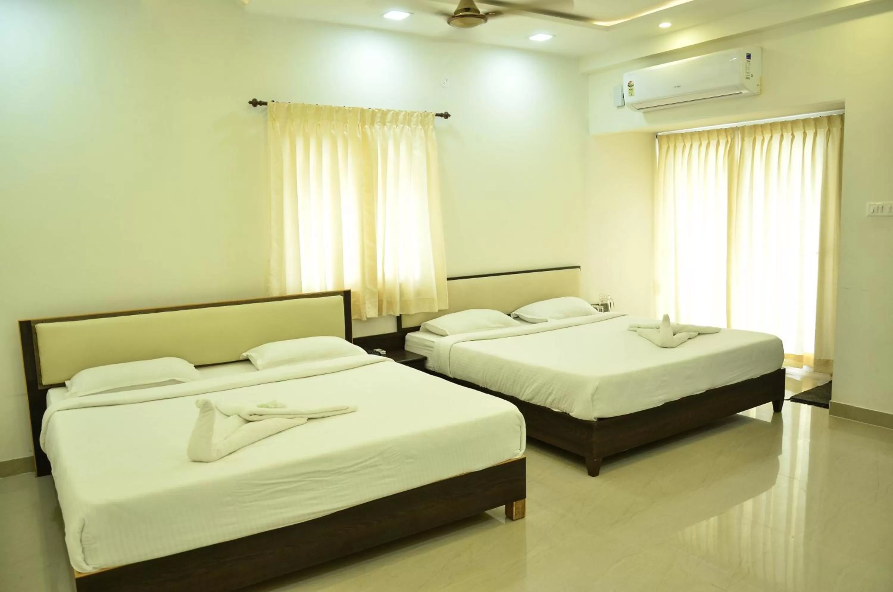 Bed in Hotel Ambai Grand