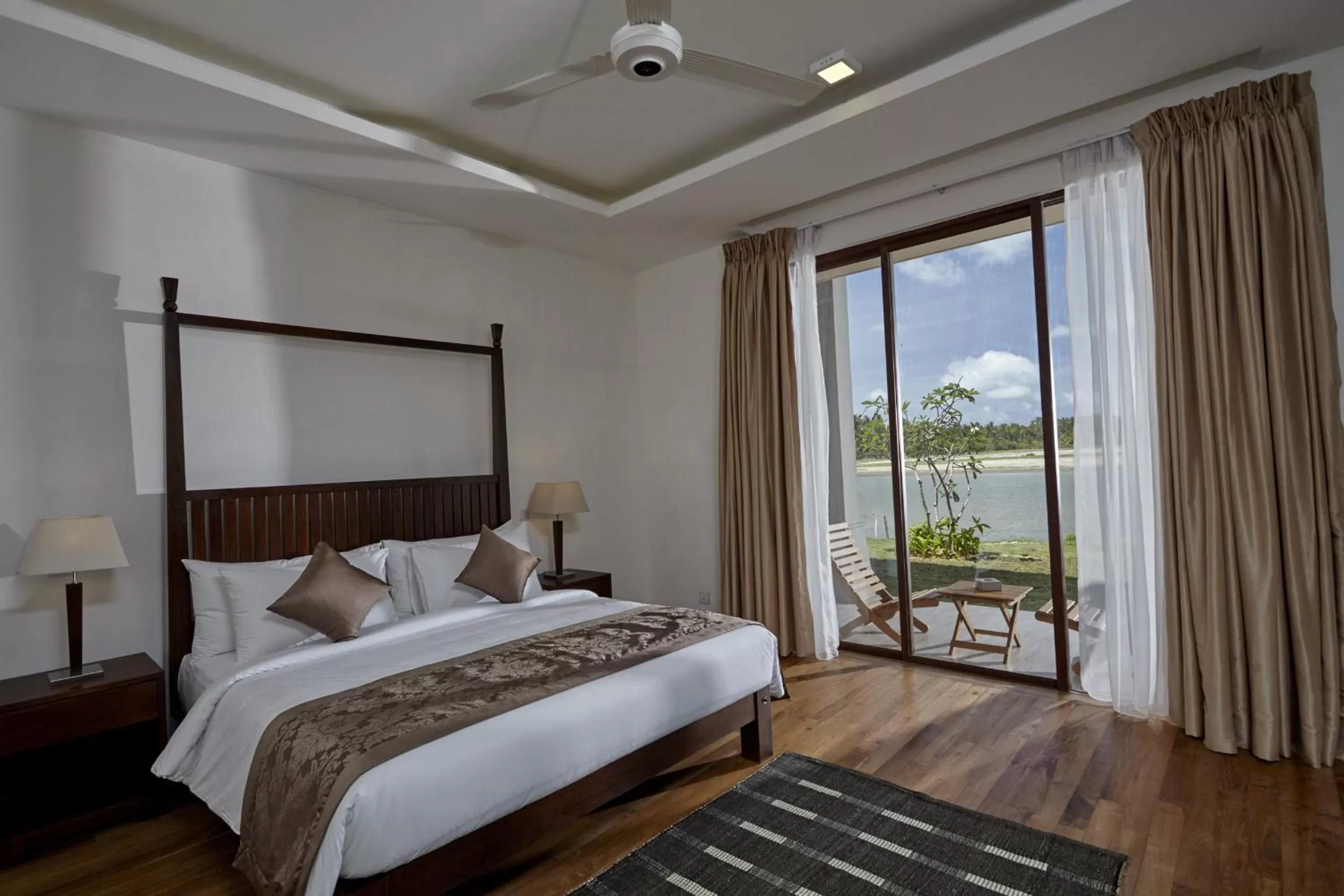 River view, Bed in Amaranthe Bay Resort & Spa